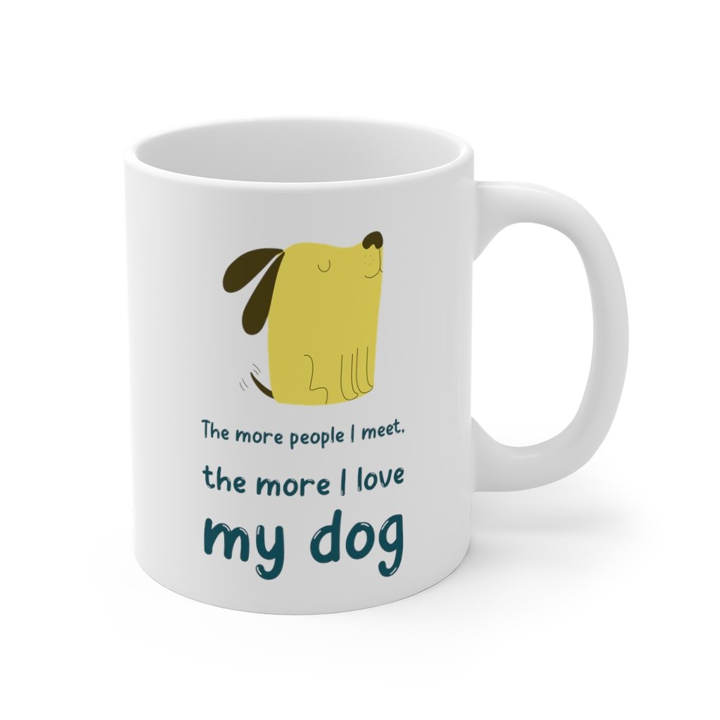 A white ceramic mug with the phrase 'The More People I Meet, The More I Love My Dog' printed on it, showcasing a classic design.