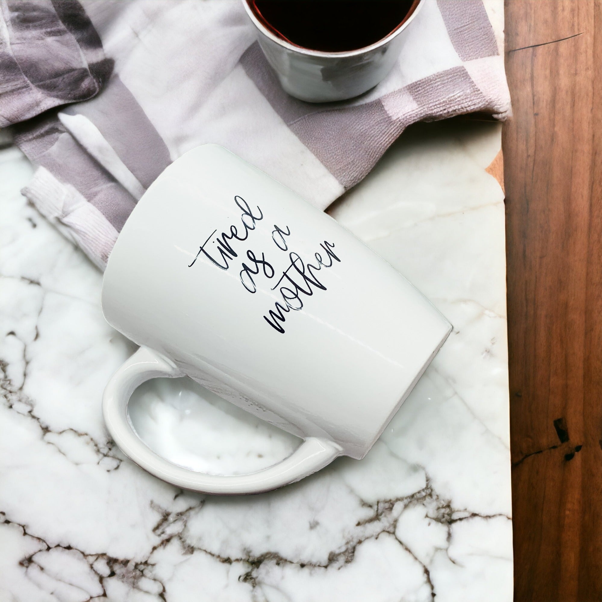 Tired as a Mother Grande mug in navy blue and white, featuring double-sided design with humorous text, perfect for mothers.