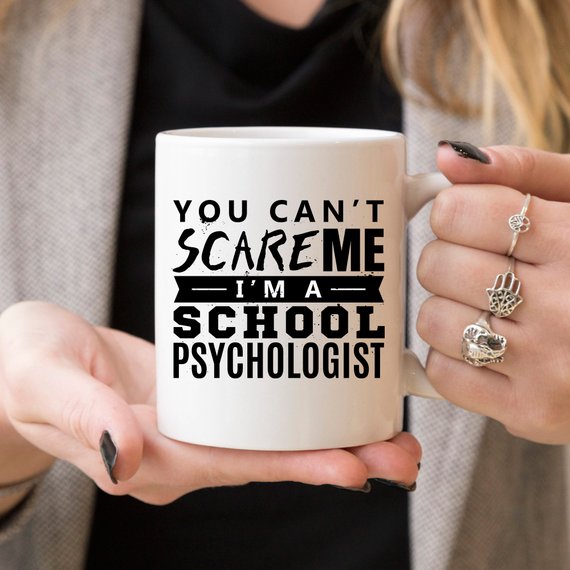Funny coffee mug with the phrase 'You Can't Scare Me. I'm A School Psychologist' printed on it, showcasing a humorous design for school psychologists.