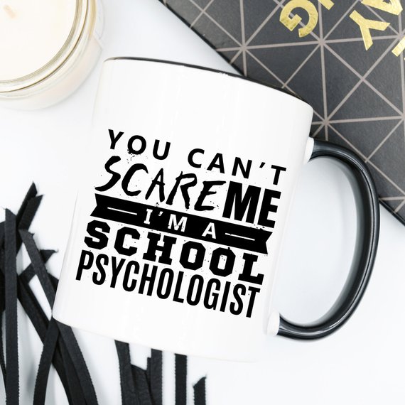 Funny coffee mug with the phrase 'You Can't Scare Me. I'm A School Psychologist' printed on it, showcasing a humorous design for school psychologists.