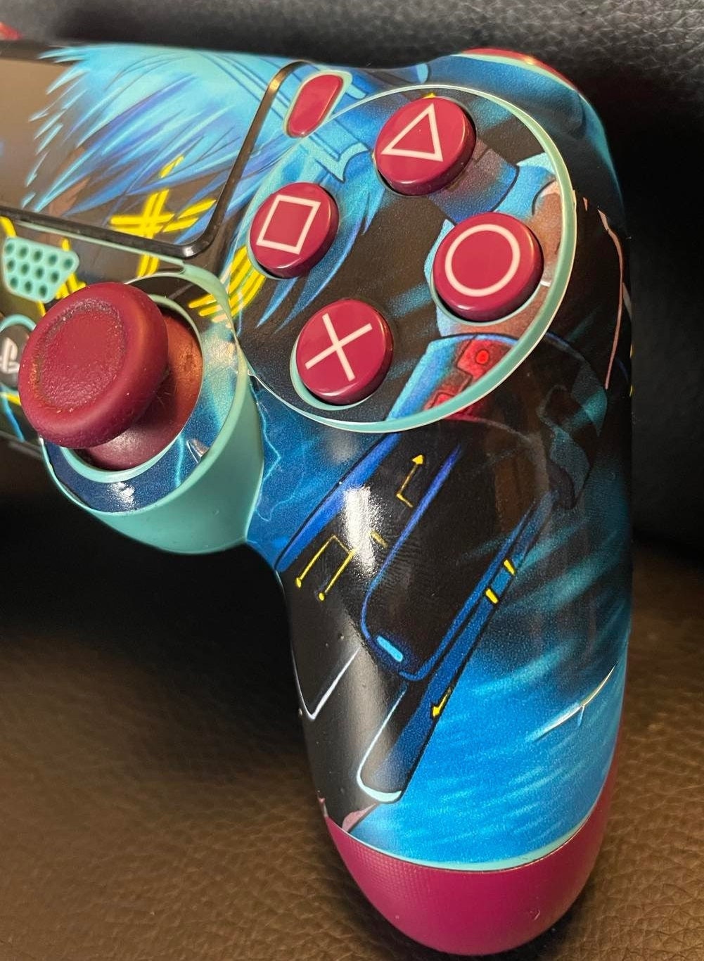 Anime Warrior Futuristic PS4 Controller Vinyl Wrap showcasing vibrant colors and intricate design, perfectly fitted on a PS4 controller.