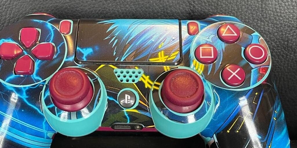 Anime Warrior Futuristic PS4 Controller Vinyl Wrap showcasing vibrant colors and intricate design, perfectly fitted on a PS4 controller.