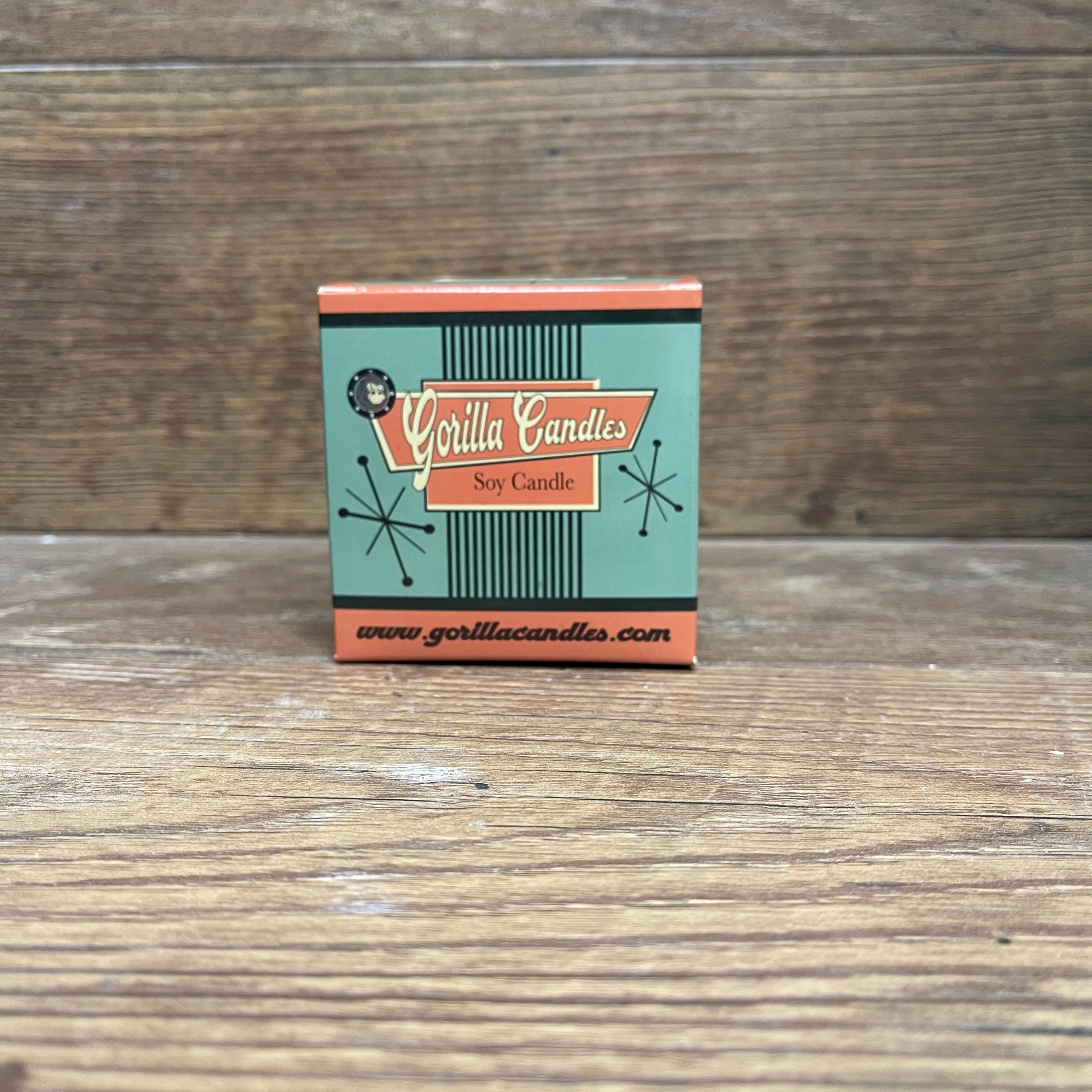 A vibrant Lollipop scented candle in a retro paint can, showcasing its colorful design and inviting aroma.