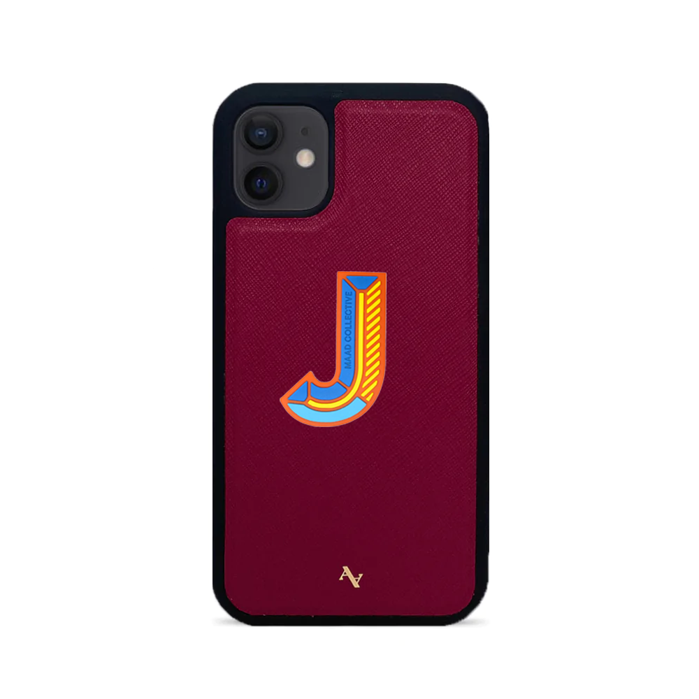 MAAD Stickers Alphabet for iPhone 12 Mini in vibrant red, showcasing customizable letters on a sleek phone case.