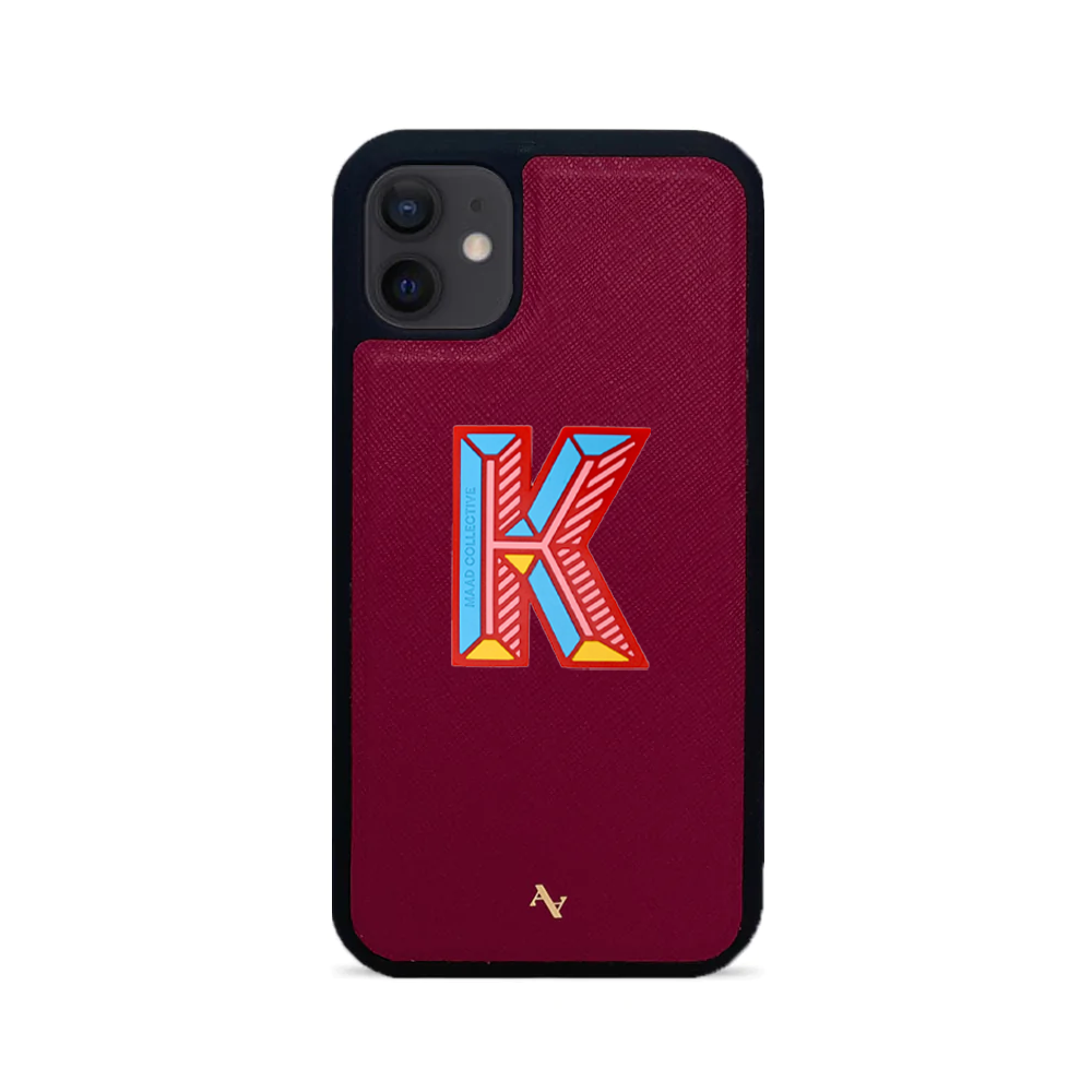 MAAD Stickers Alphabet for iPhone 12 Mini in vibrant red, showcasing customizable letters on a sleek phone case.