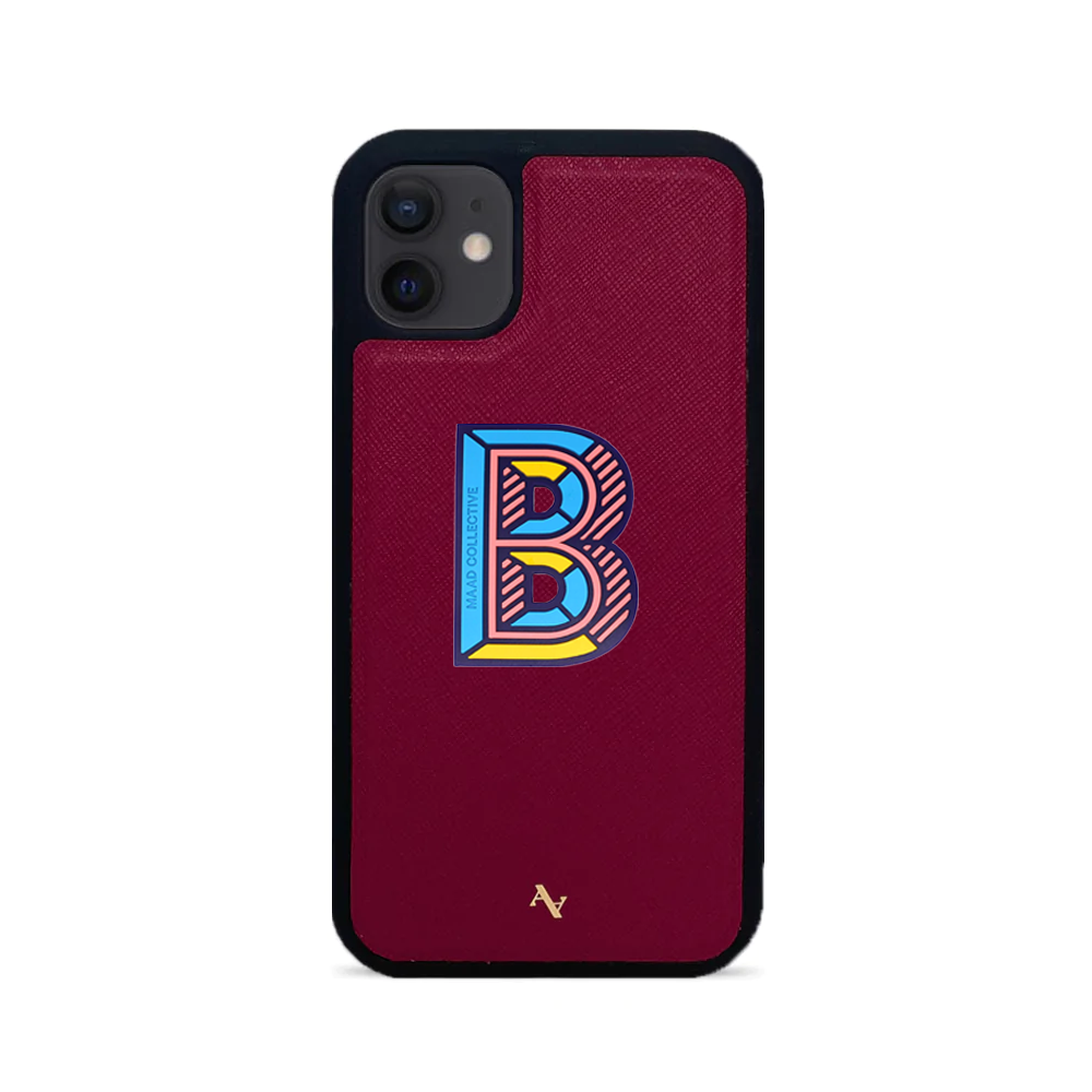 MAAD Stickers Alphabet for iPhone 12 Mini in vibrant red, showcasing customizable letters on a sleek phone case.