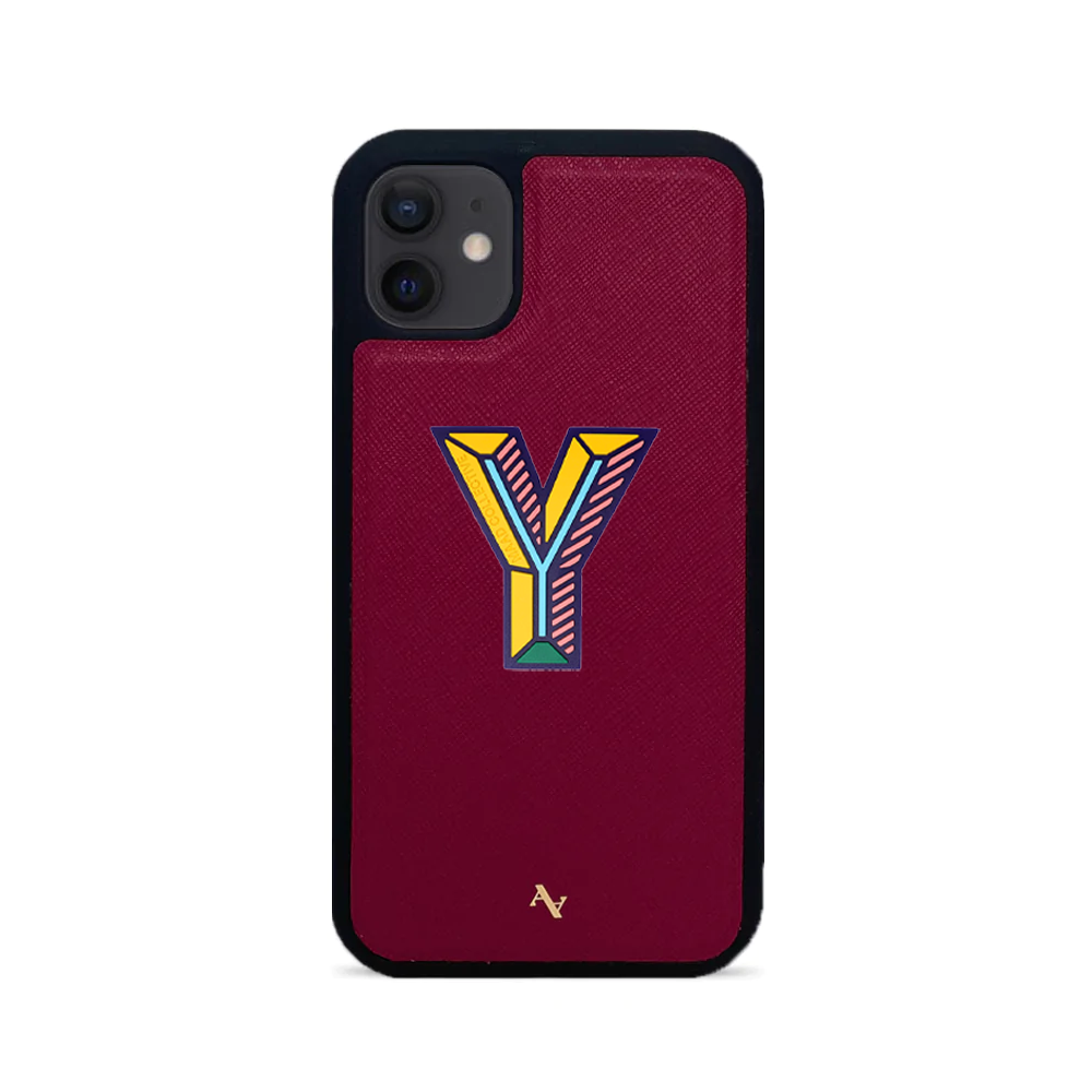 MAAD Stickers Alphabet for iPhone 12 in vibrant colors, showcasing customizable letters and a protective case.