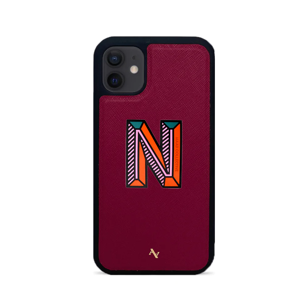 MAAD Stickers Alphabet for iPhone 12 in vibrant colors, showcasing customizable letters and a protective case.