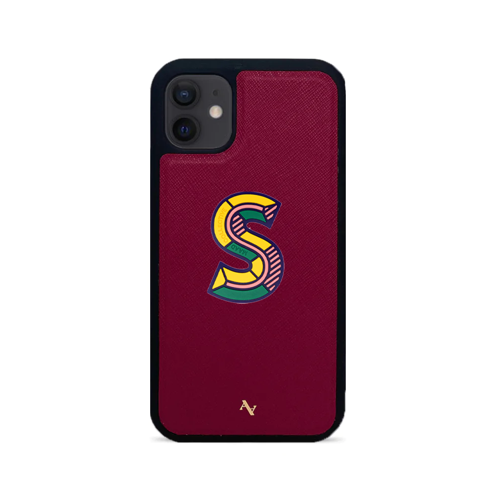 MAAD Stickers Alphabet for iPhone 12 in vibrant colors, showcasing customizable letters and a protective case.