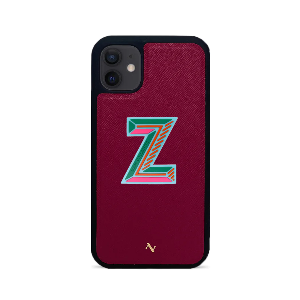 MAAD Stickers Alphabet for iPhone 12 in vibrant colors, showcasing customizable letters and a protective case.