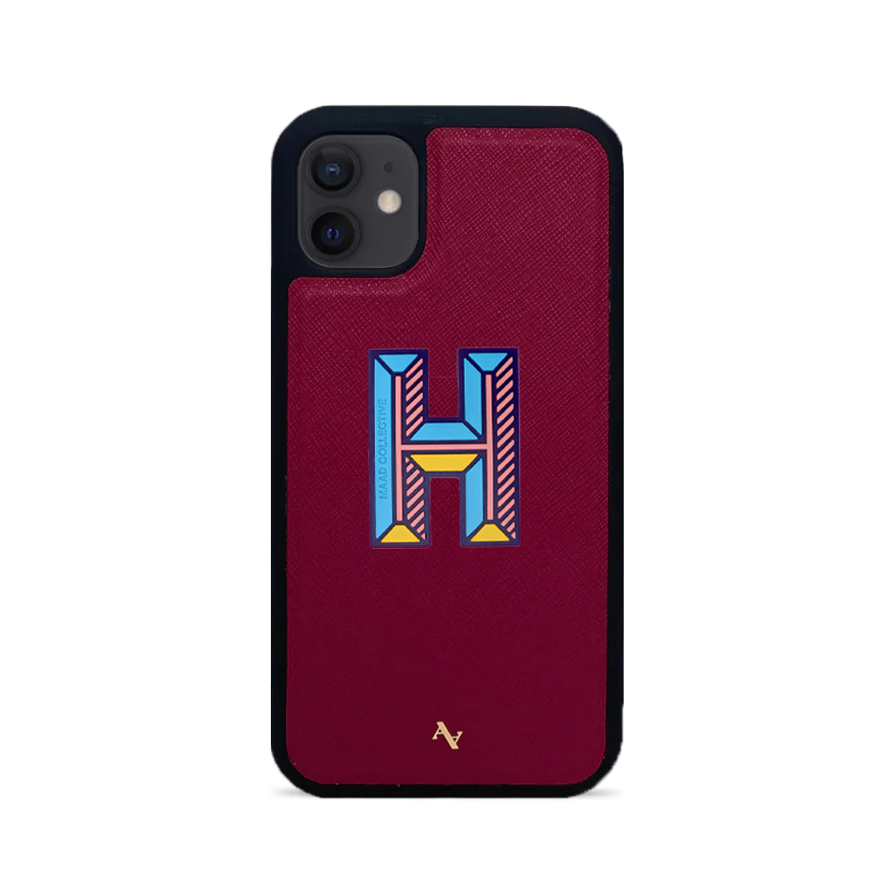 MAAD Stickers Alphabet for iPhone 12 in vibrant colors, showcasing customizable letters and a protective case.