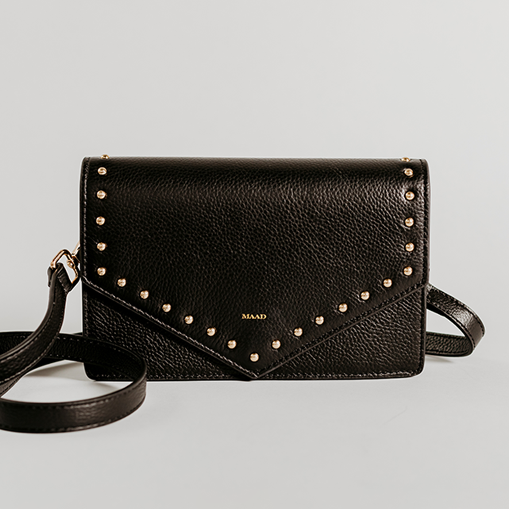 Match Black Studs Crossbody bag made of smooth pebble leather with black studs and an adjustable strap.