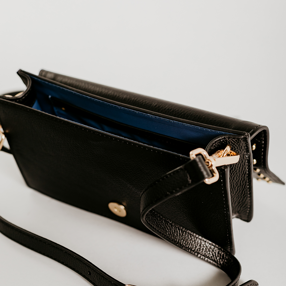 Match Black Studs Crossbody bag made of smooth pebble leather with black studs and an adjustable strap.