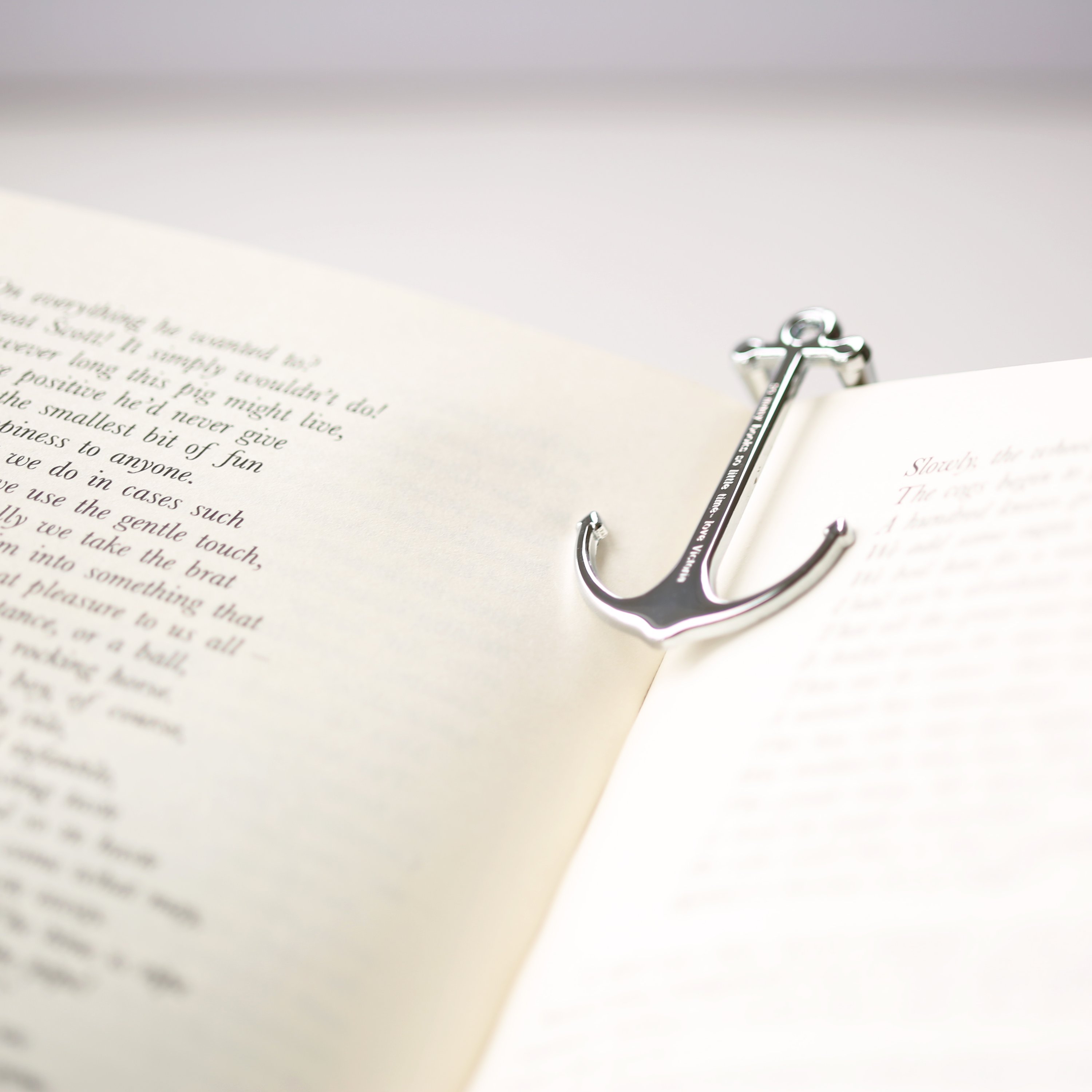 Personalised Silver & Black Book Anchor, elegantly designed with a modern font engraving, perfect for holding books open.