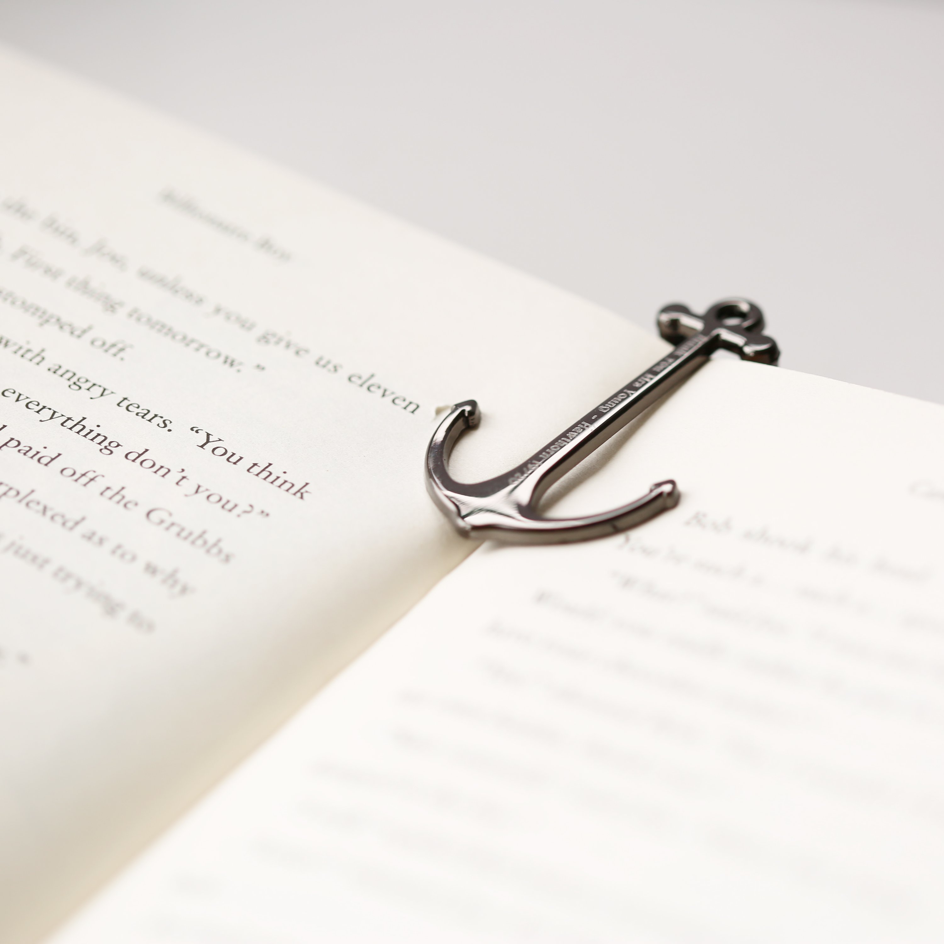 Personalised Silver & Black Book Anchor, elegantly designed with a modern font engraving, perfect for holding books open.