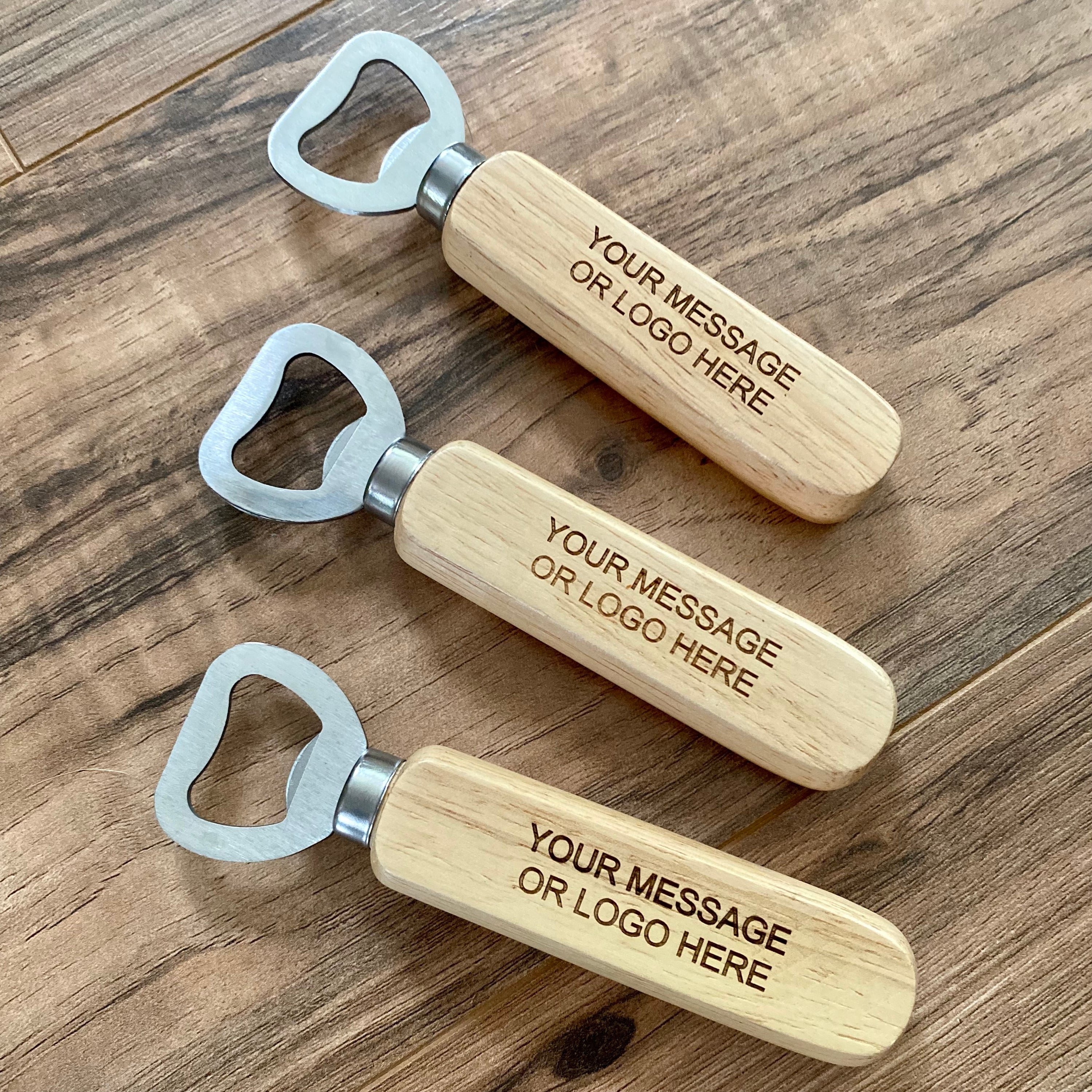 Custom engraved wood bottle opener with stainless steel cap remover, featuring a personalized message.