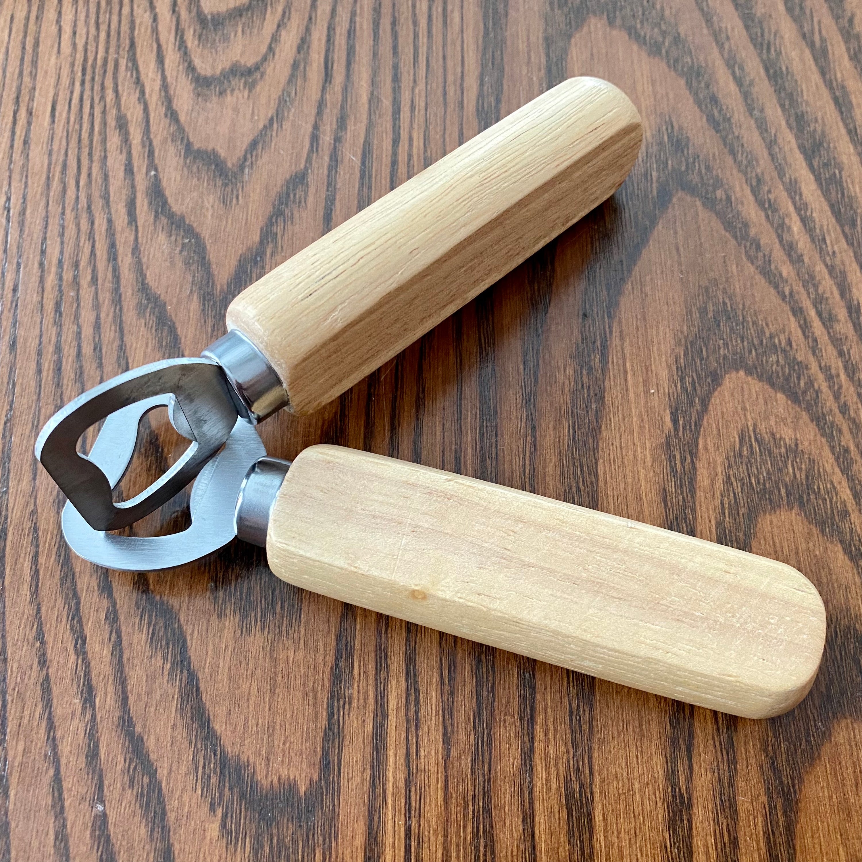 Custom engraved wood bottle opener with stainless steel cap remover, featuring a personalized message.