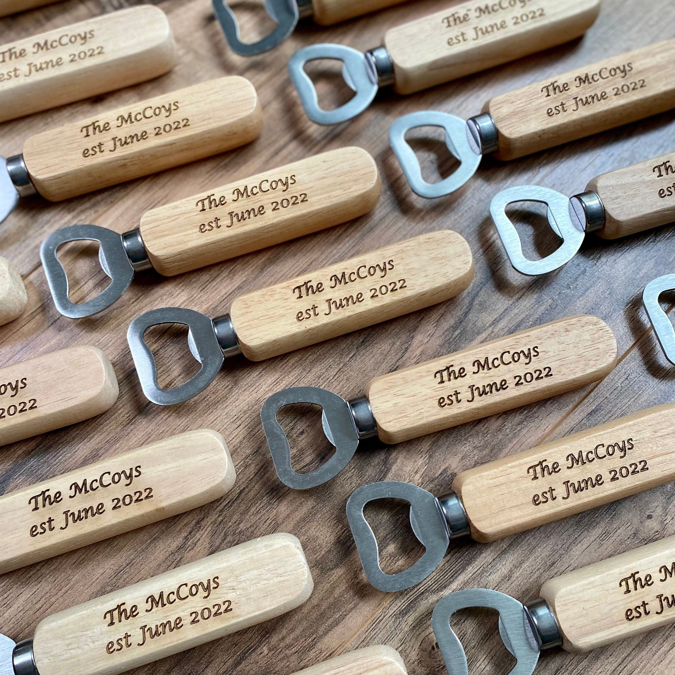Custom engraved wooden bottle opener with stainless steel cap remover, showcasing personalized engraving.