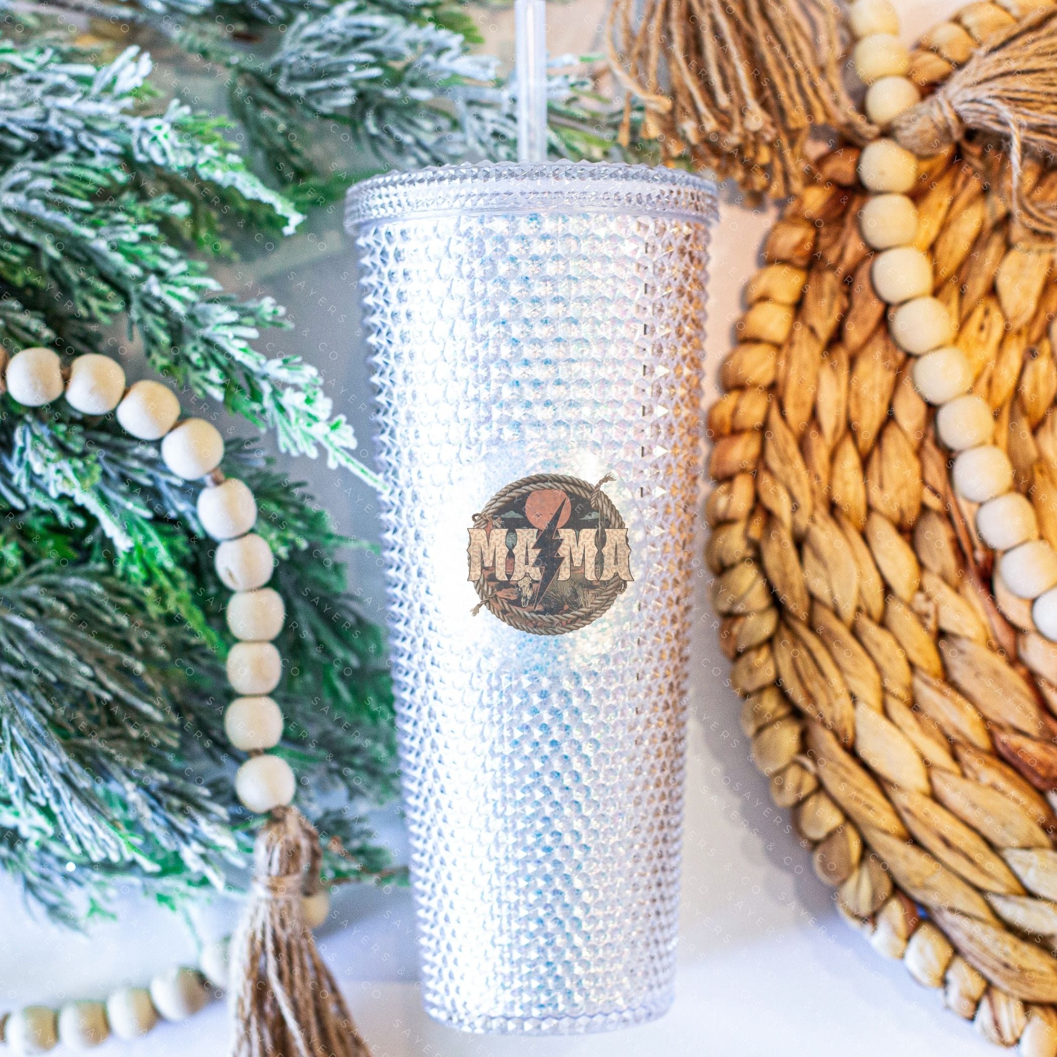 Custom Studded 24oz Double Walled Tumbler featuring a Western Mama design, complete with a lid and straw, showcasing a stylish studded exterior.
