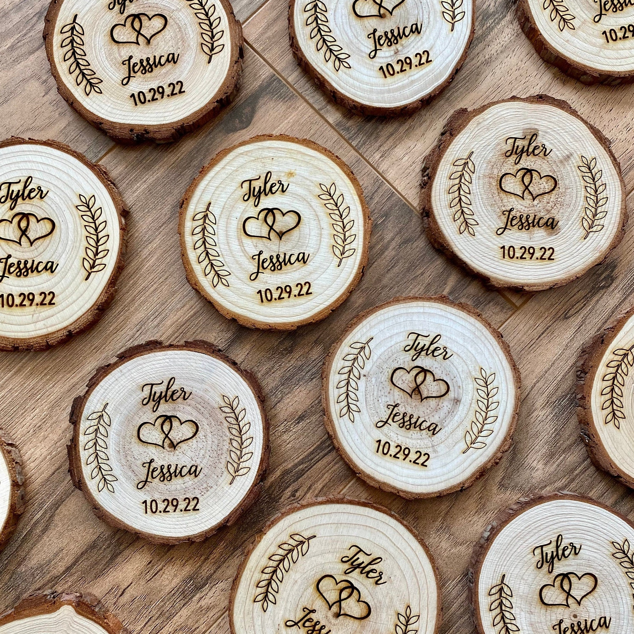 Personalized wood slice coasters with laser engraving, perfect for rustic wedding favors.