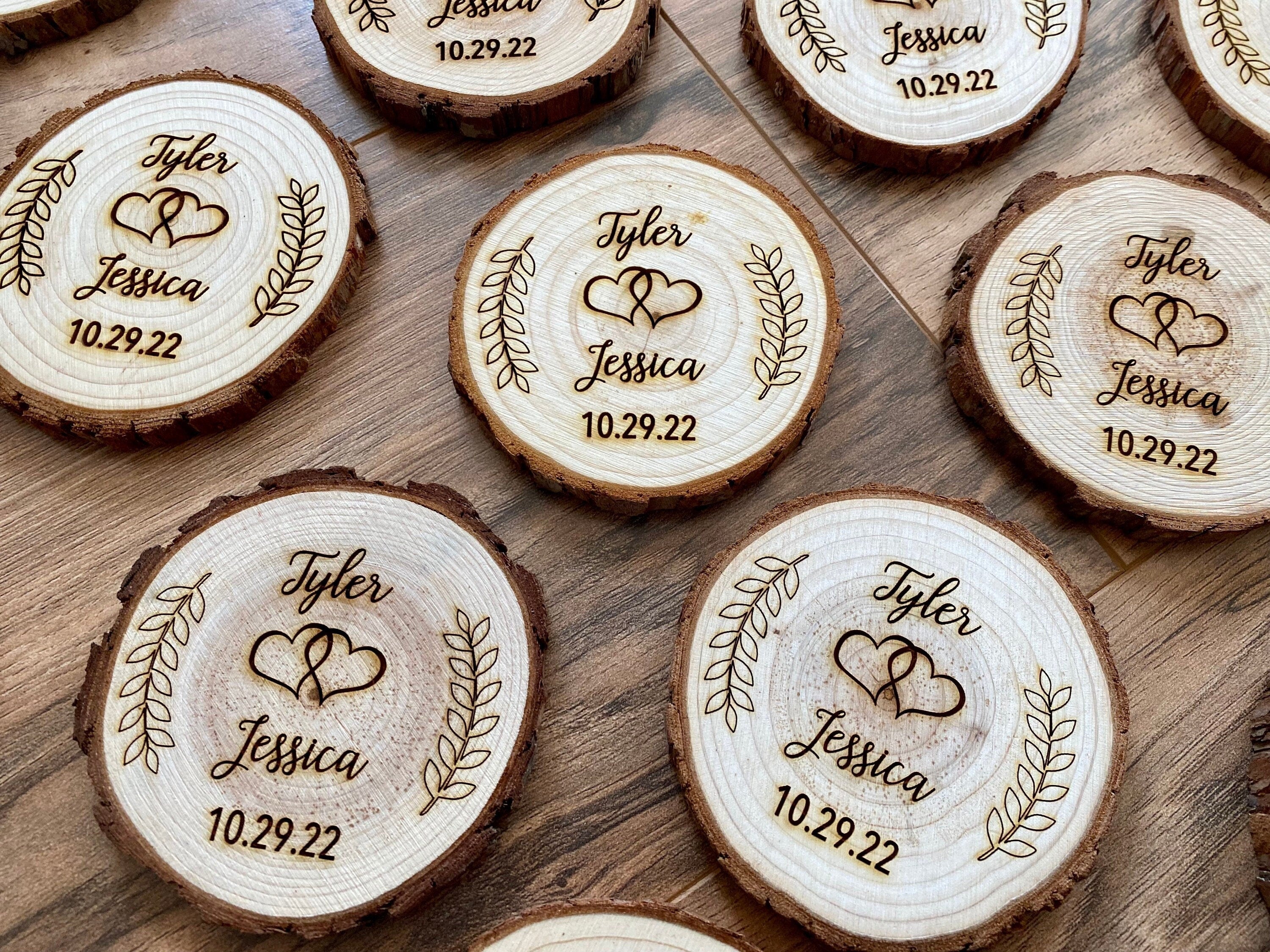 Personalized wood slice coasters with laser engraving, perfect for rustic wedding favors.