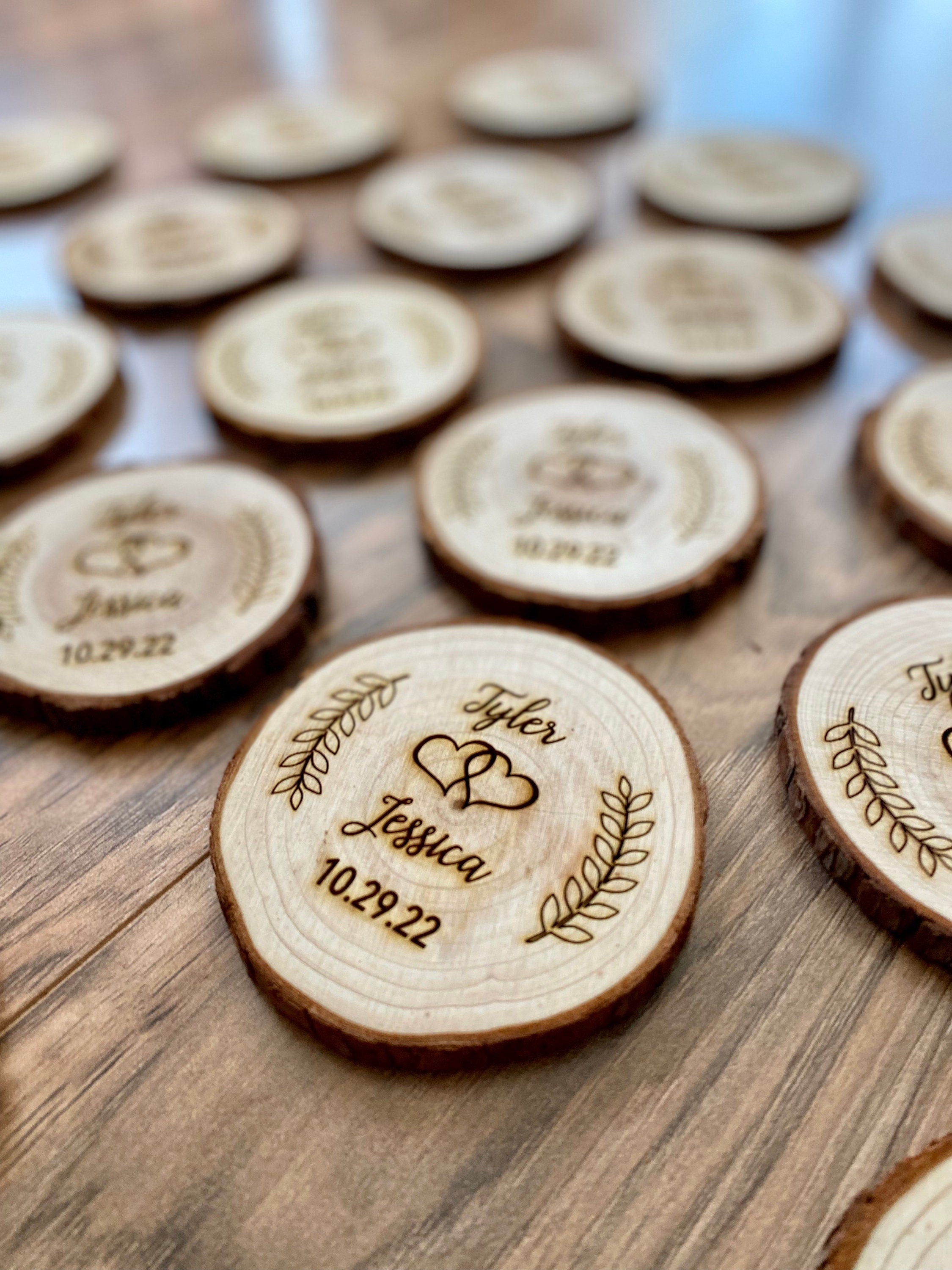 Personalized wood slice coasters with laser engraving, perfect for rustic wedding favors.