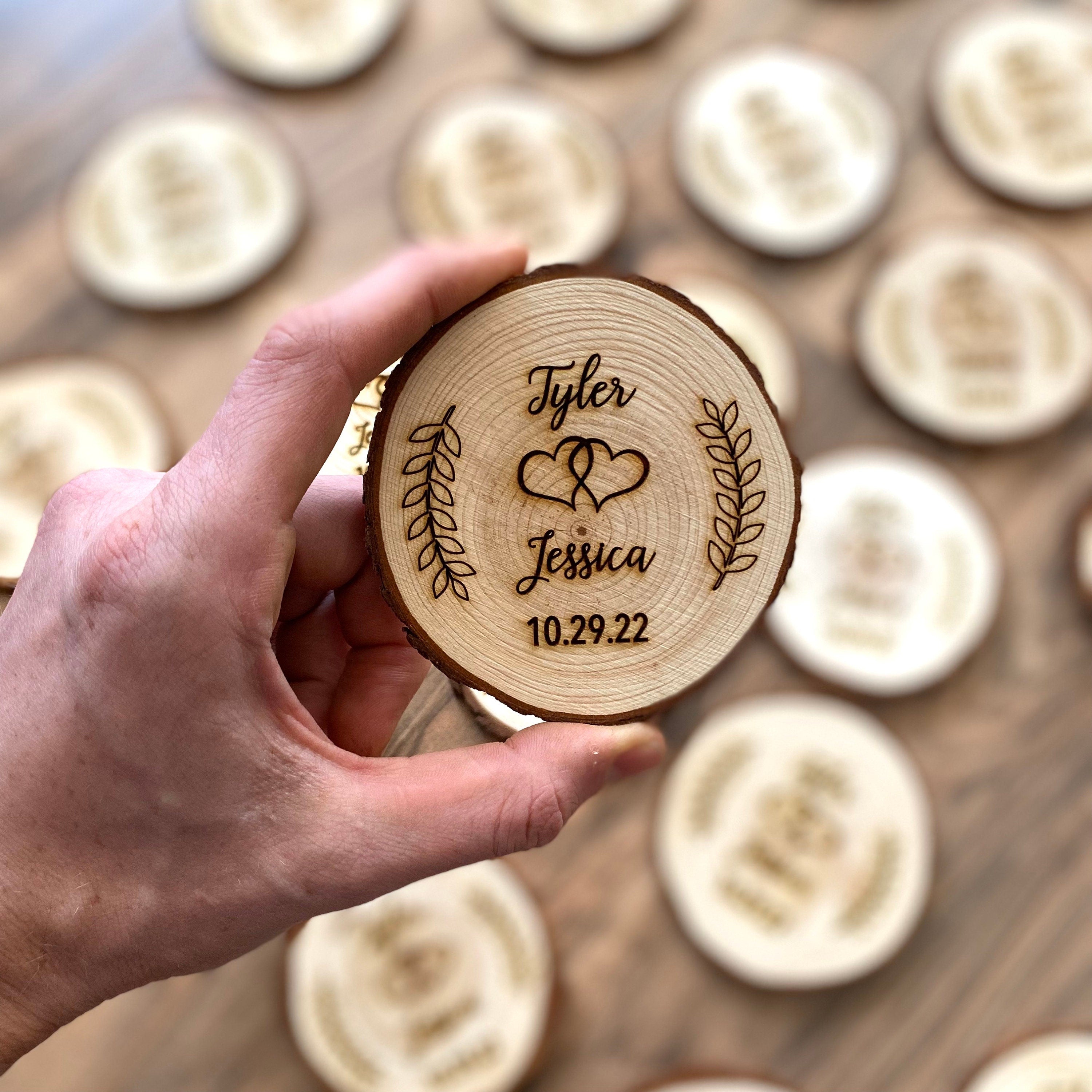 Personalized wood slice coasters with laser engraving, perfect for rustic wedding favors.