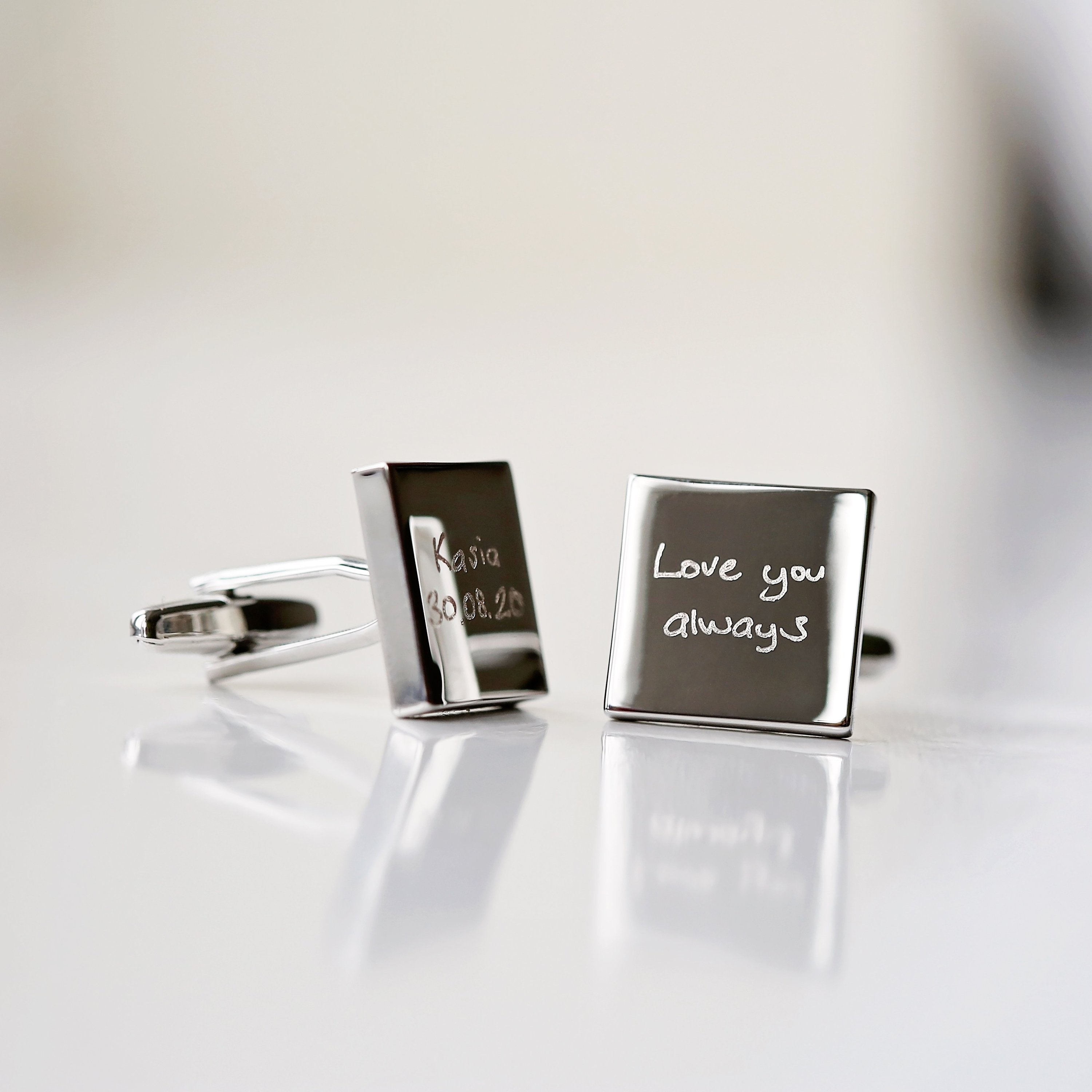 Engraved cufflinks featuring personalized handwriting in a stylish design, made from polished stainless steel.