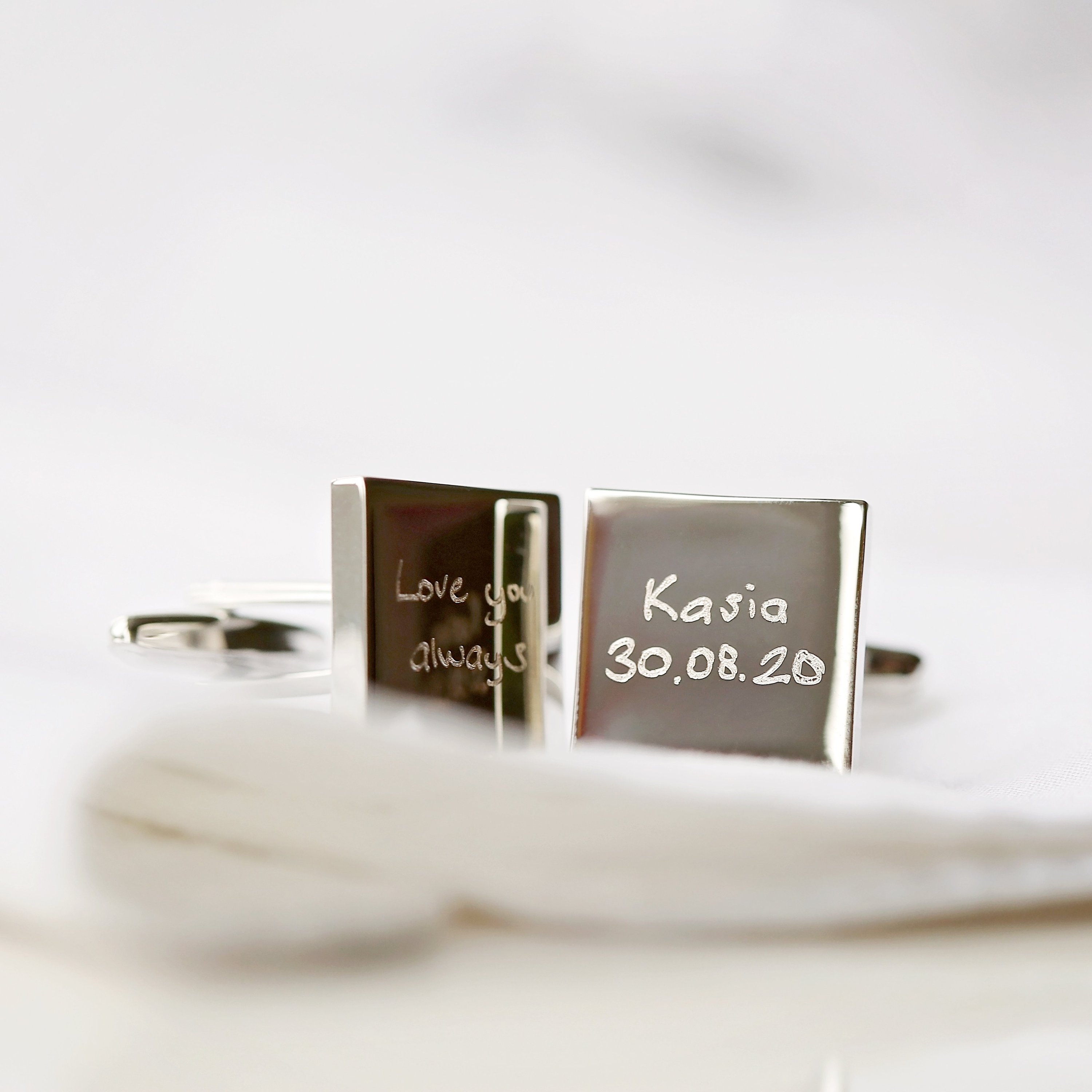 Engraved cufflinks featuring personalized handwriting in a stylish design, made from polished stainless steel.
