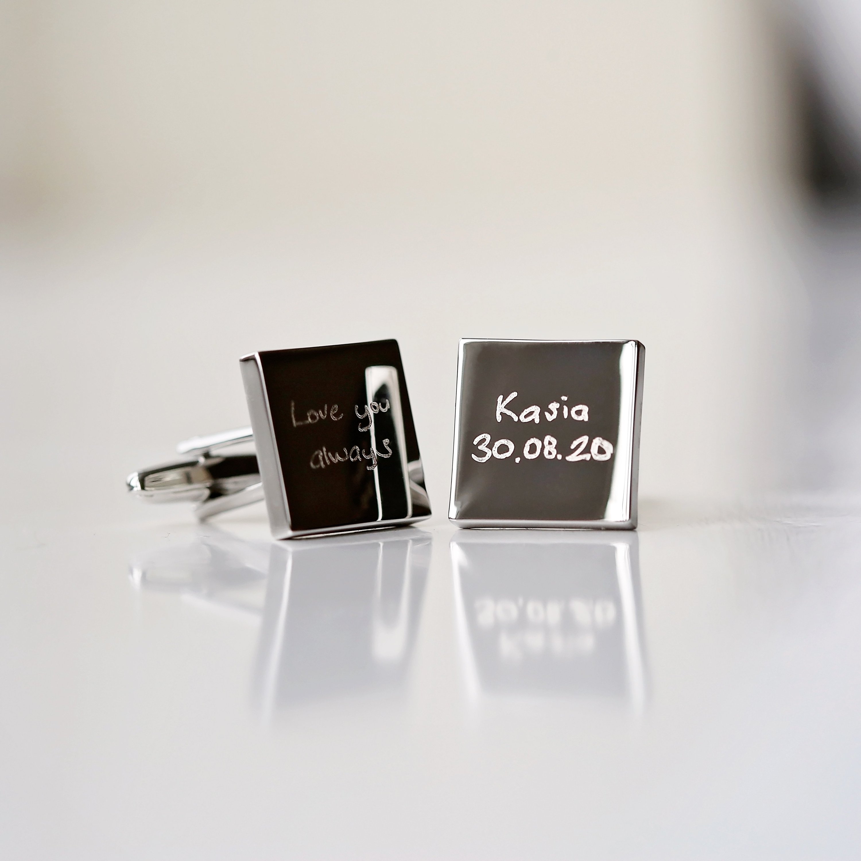 Engraved cufflinks featuring personalized handwriting in a stylish design, made from polished stainless steel.