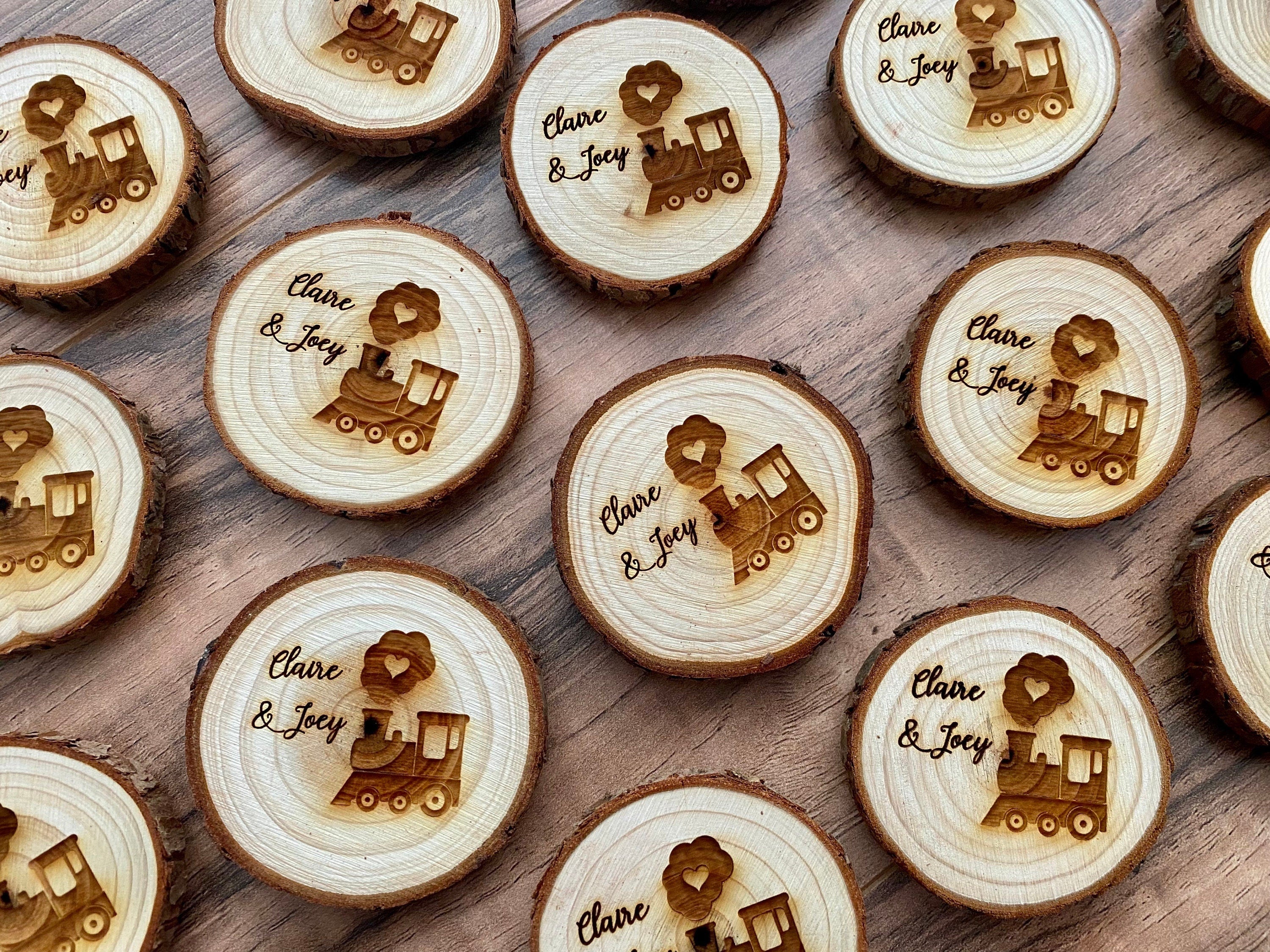 Personalized engraved wood slice birthday party favor featuring a cute train image and custom names, with a magnet on the back.