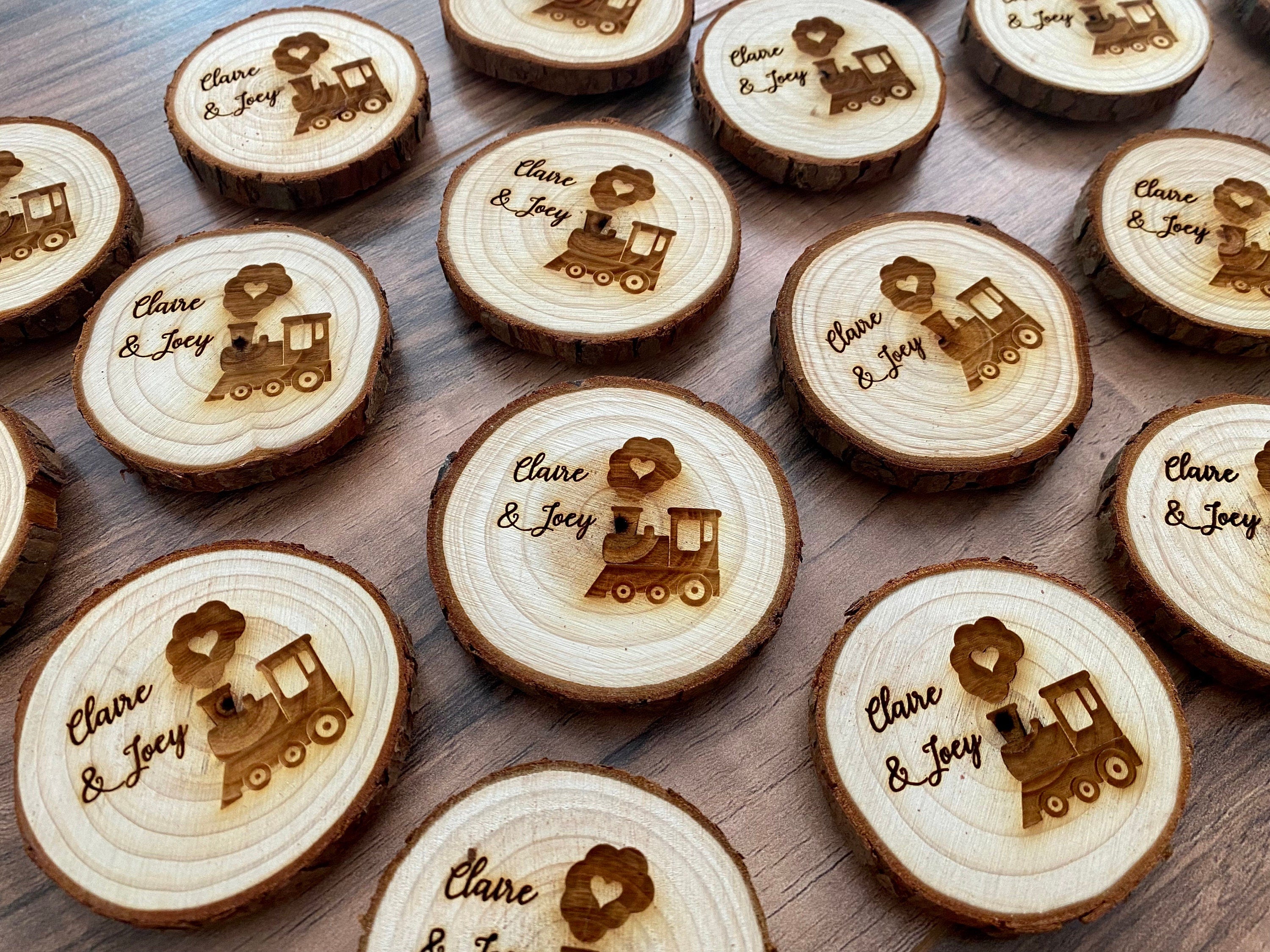 Personalized engraved wood slice birthday party favor featuring a cute train image and custom names, with a magnet on the back.
