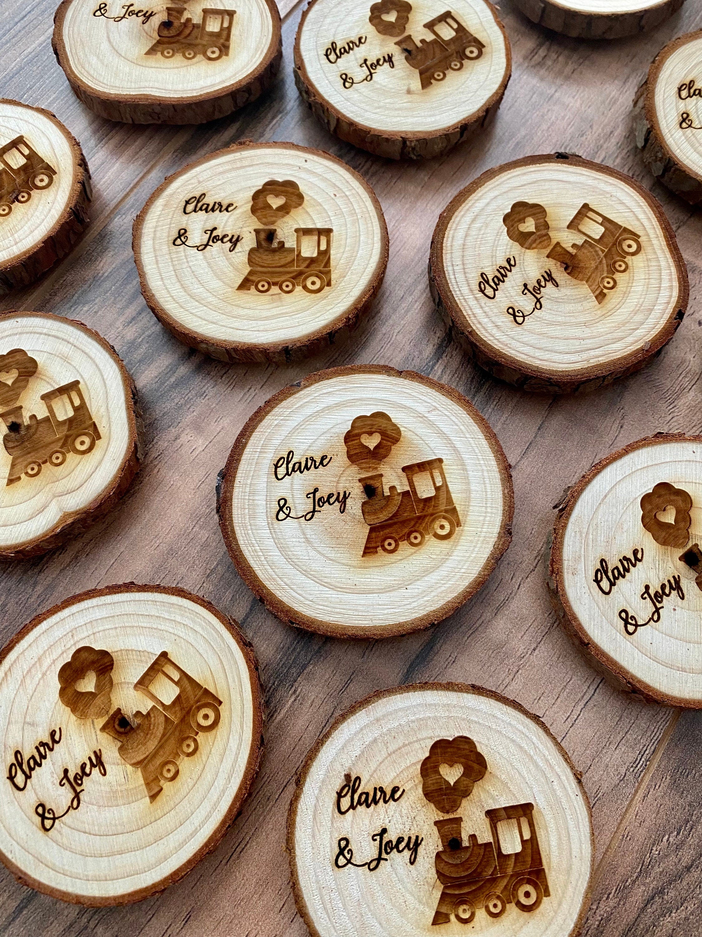 Personalized engraved wood slice birthday party favor featuring a cute train image and custom names, with a magnet on the back.
