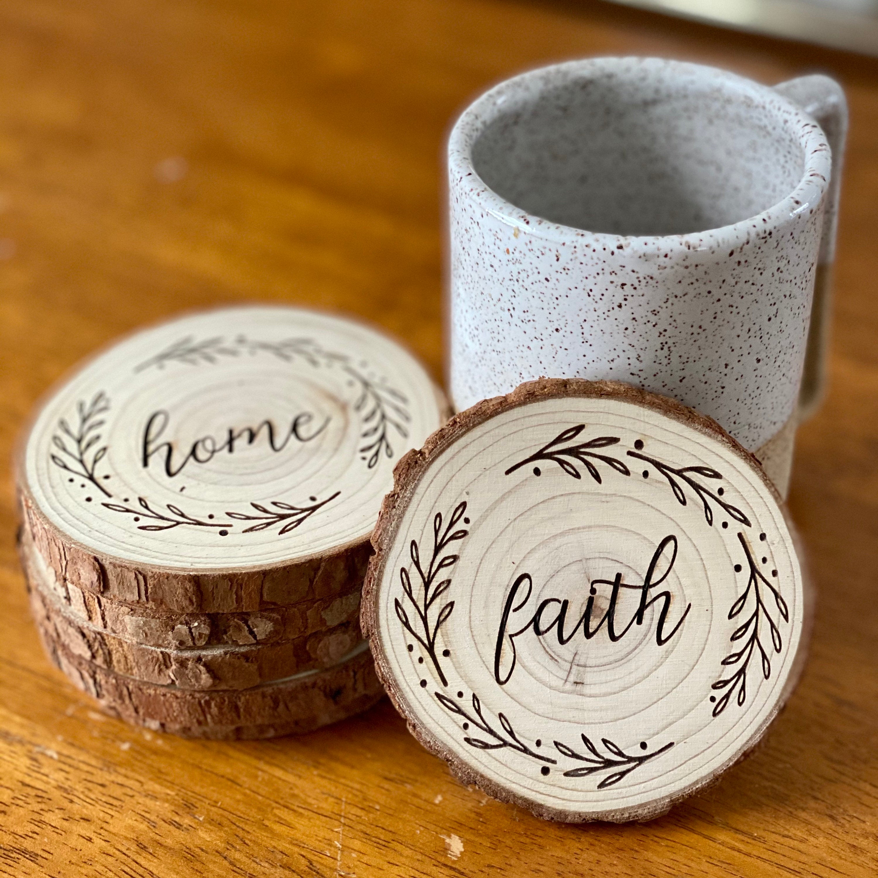 A beautifully crafted set of wood coasters engraved with the words Faith, Hope, and Love, showcasing rustic charm and natural wood grain.