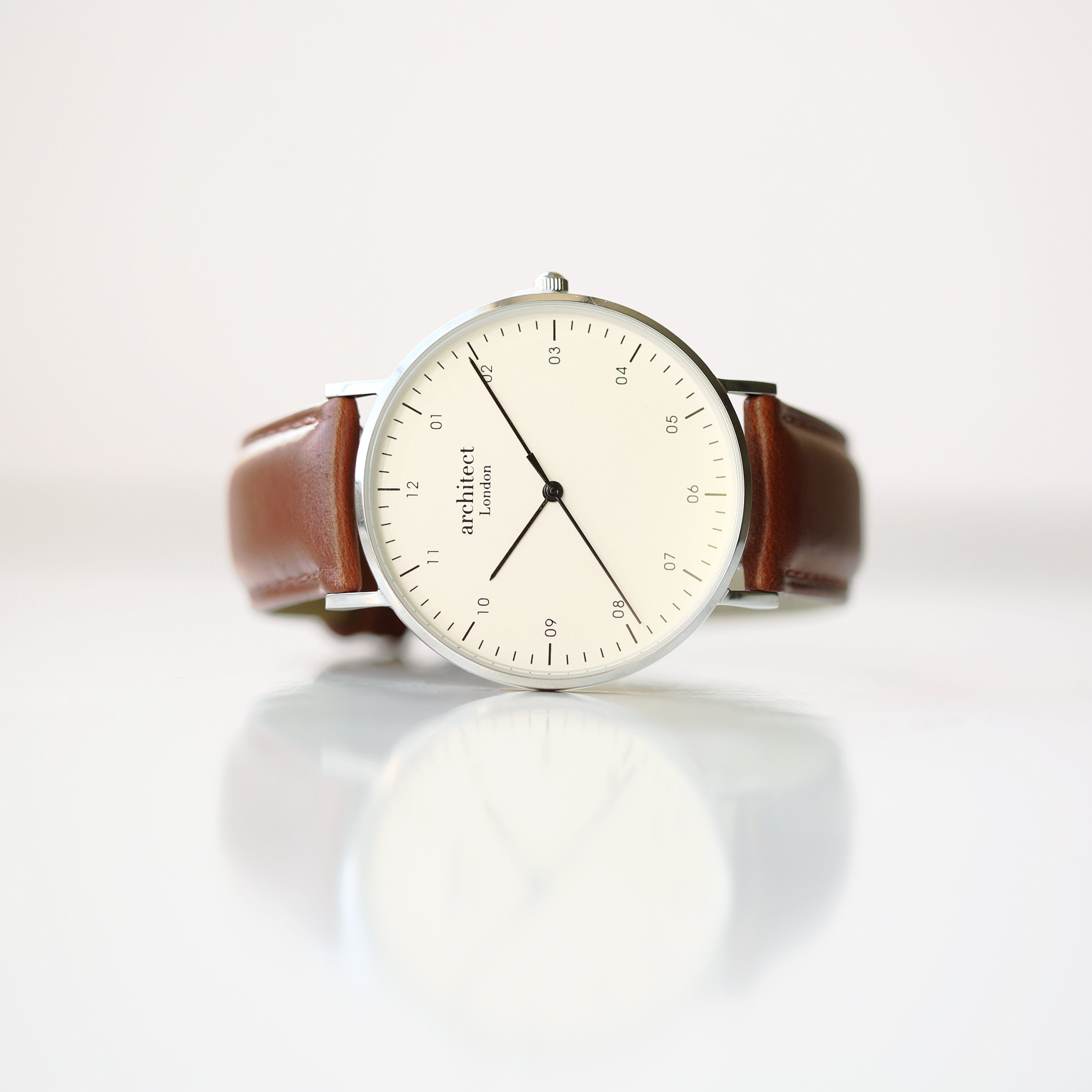 Men's Architect Zephyr watch featuring a walnut strap and personalized handwriting engraving on the back.