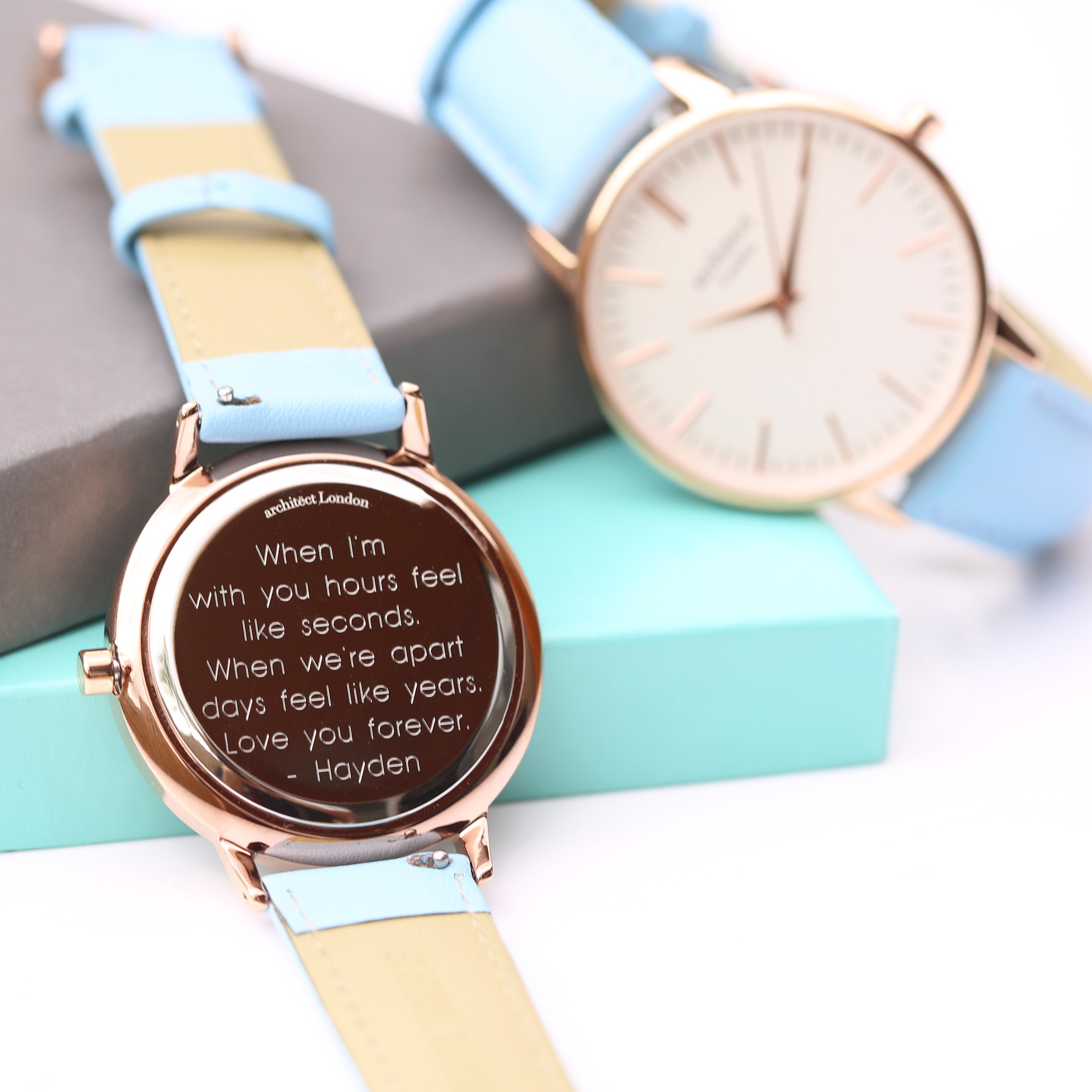 Ladies Architēct Blanc watch featuring a light blue genuine leather strap and modern font engraving on the back.