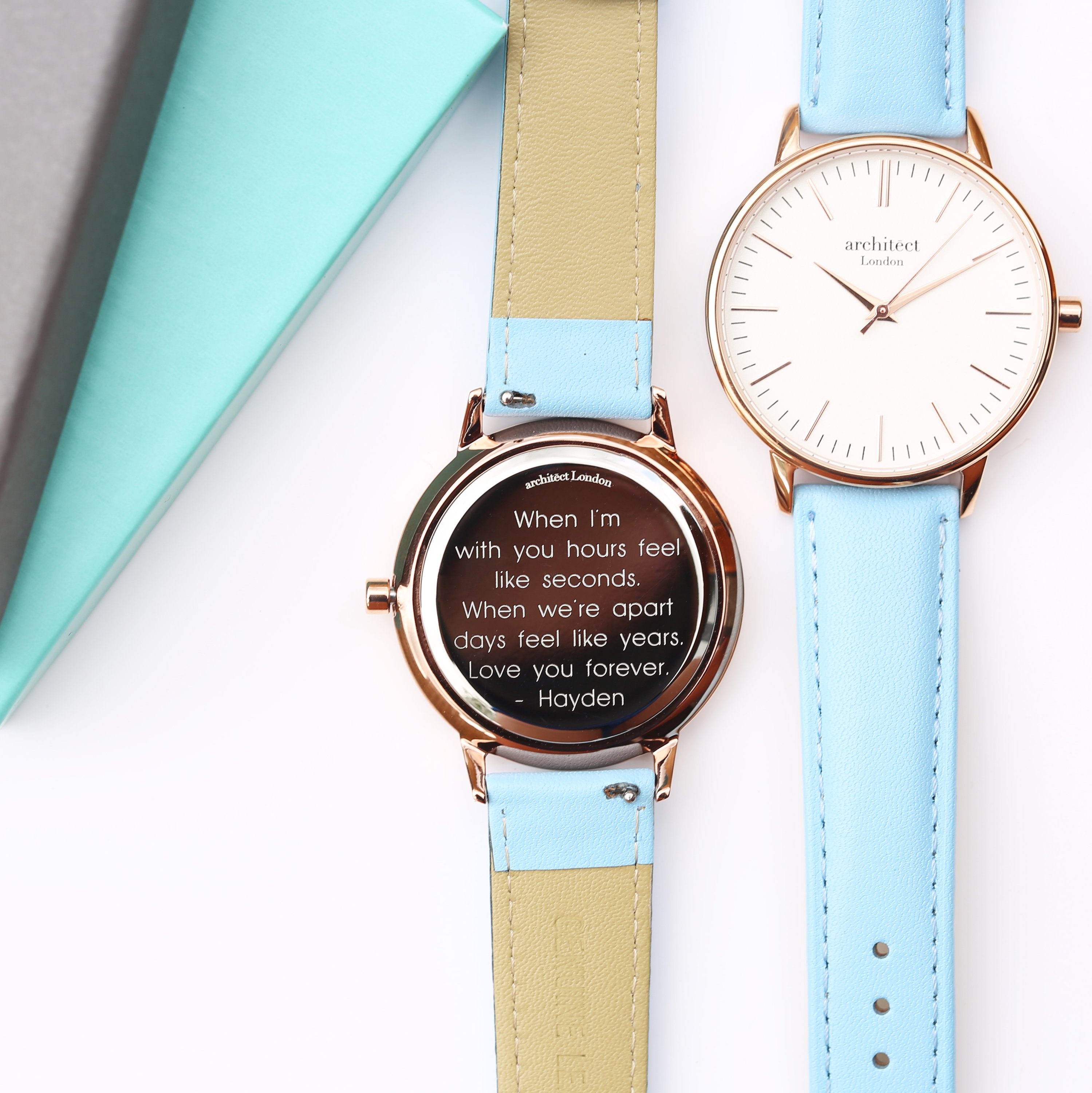 Ladies Architēct Blanc watch featuring a light blue genuine leather strap and modern font engraving on the back.