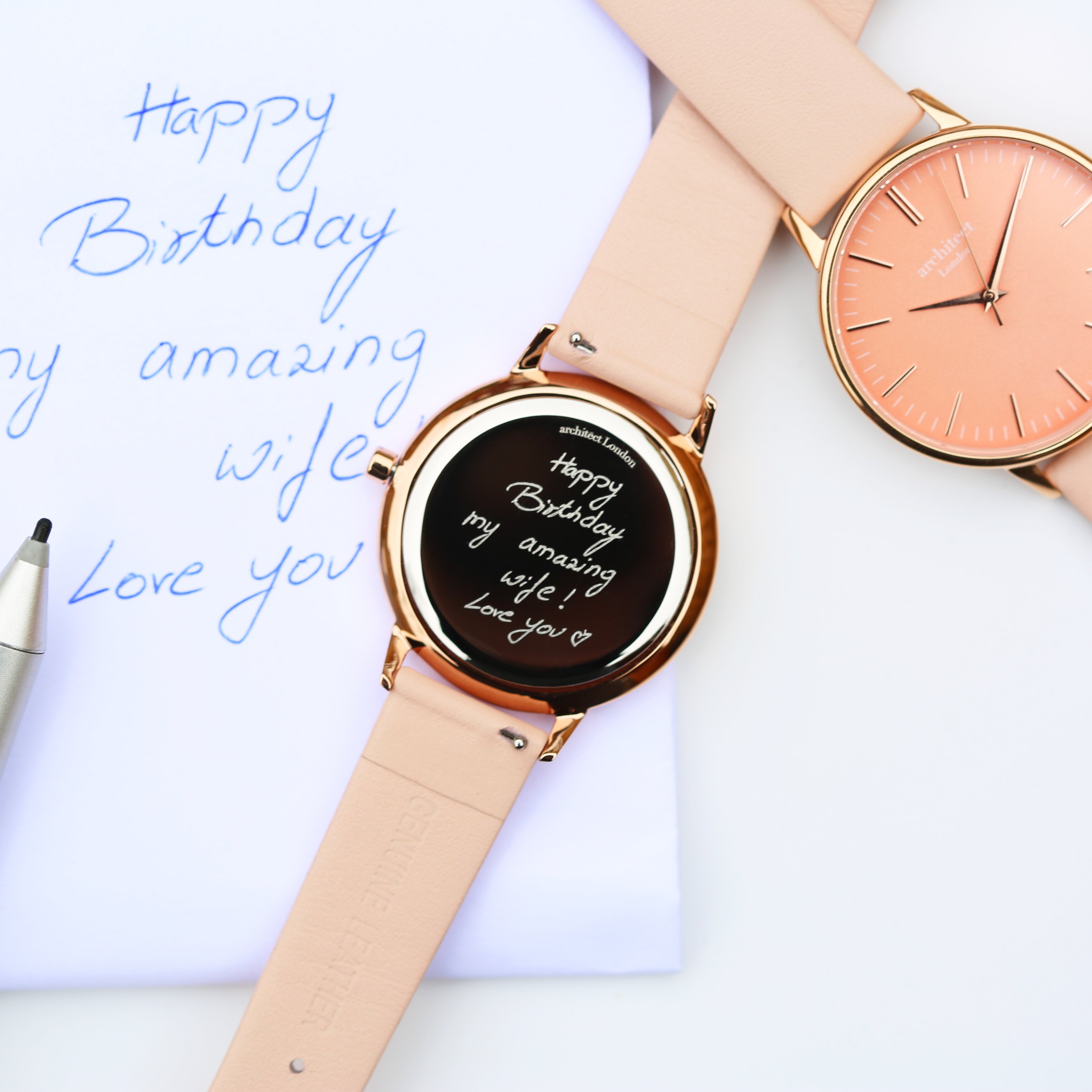 Ladies Architēct Coral watch featuring a light pink leather strap and personalized handwriting engraving on the back.