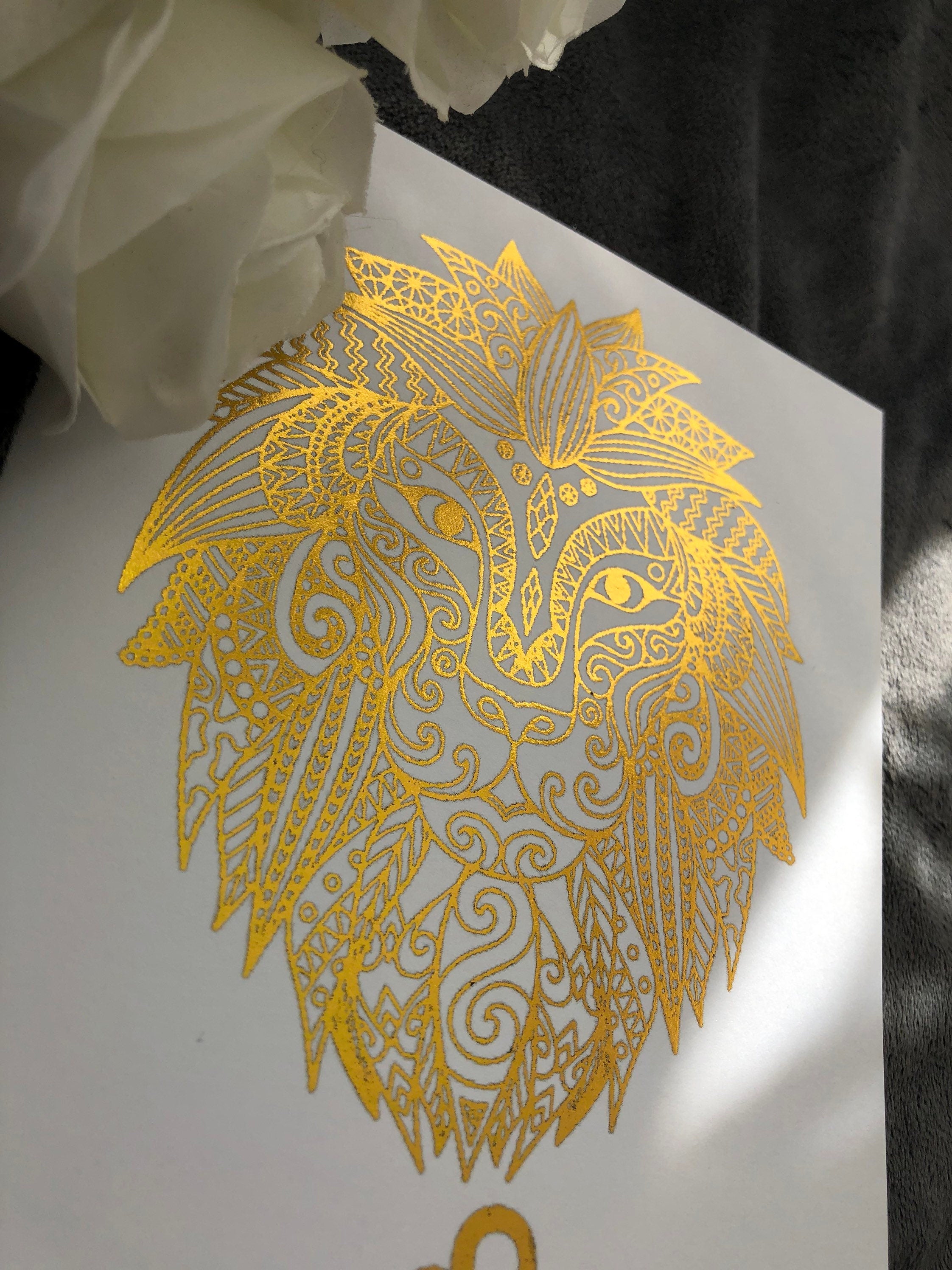 A beautiful Leo Star Sign Foil Print featuring a majestic lion symbol, showcasing vibrant colors and a luxurious foil finish.
