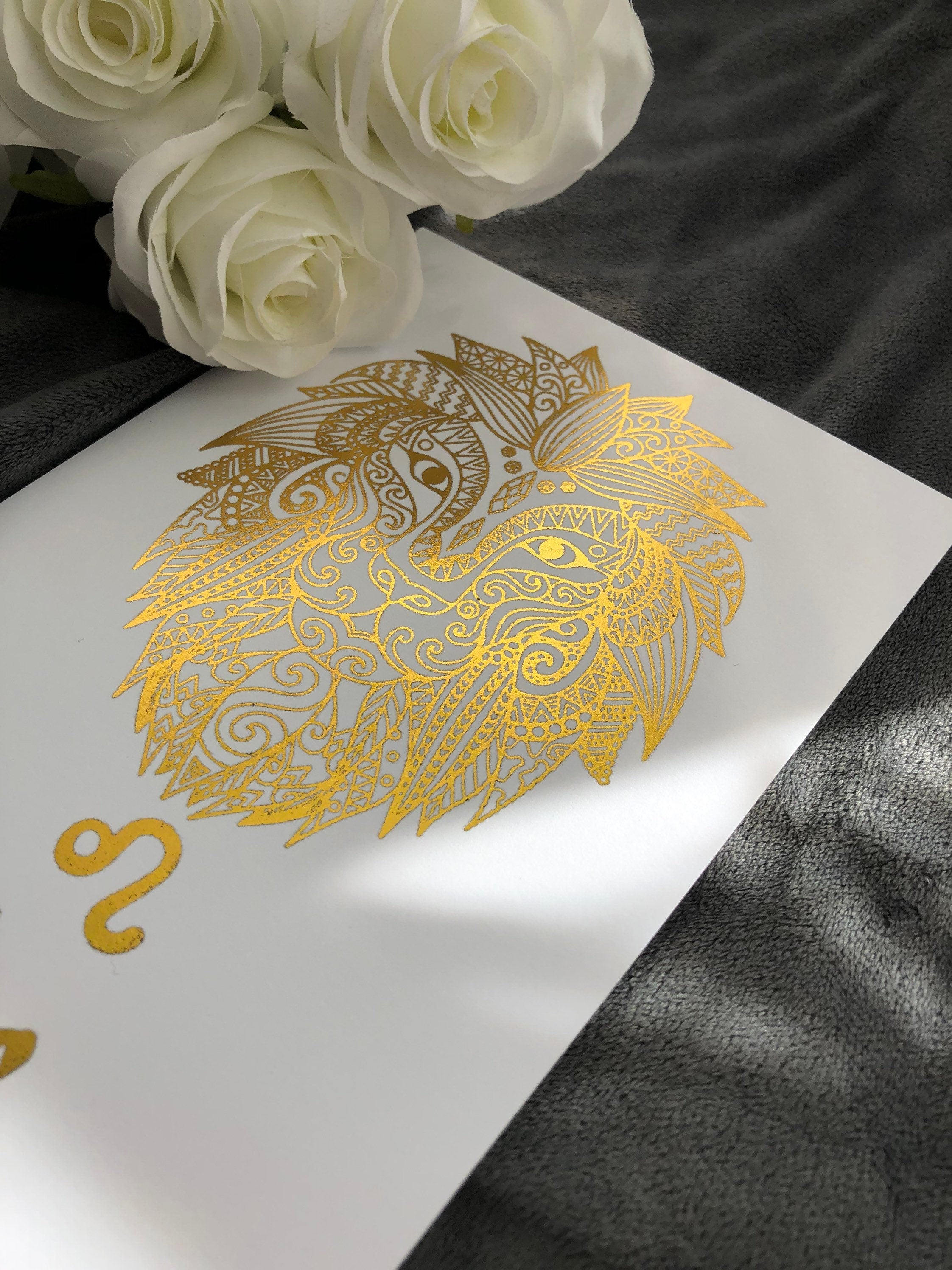 A beautiful Leo Star Sign Foil Print featuring a majestic lion symbol, showcasing vibrant colors and a luxurious foil finish.