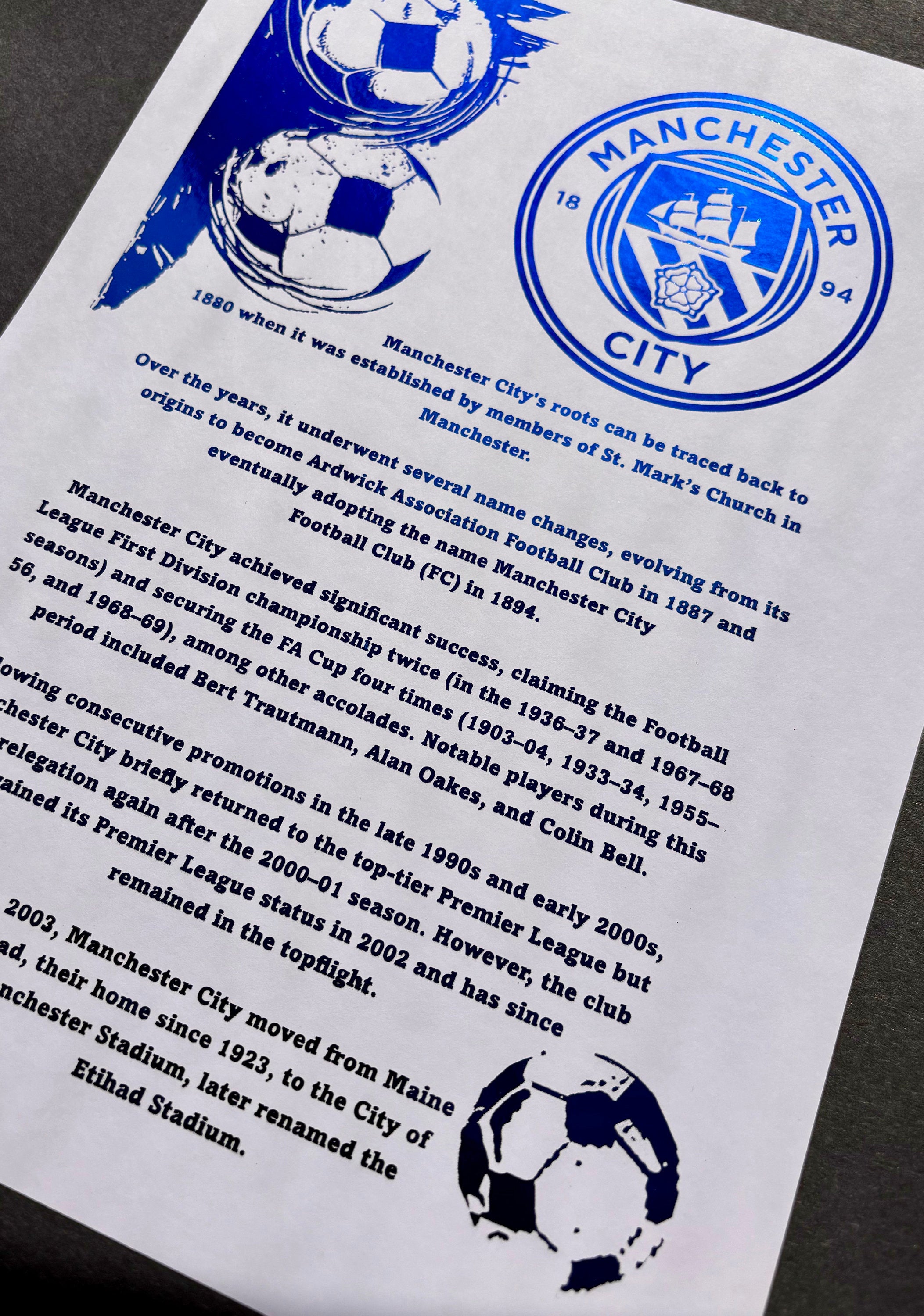 A4 foil print of Manchester City FC logo in radiant blue foil, showcasing the club's rich history and achievements.