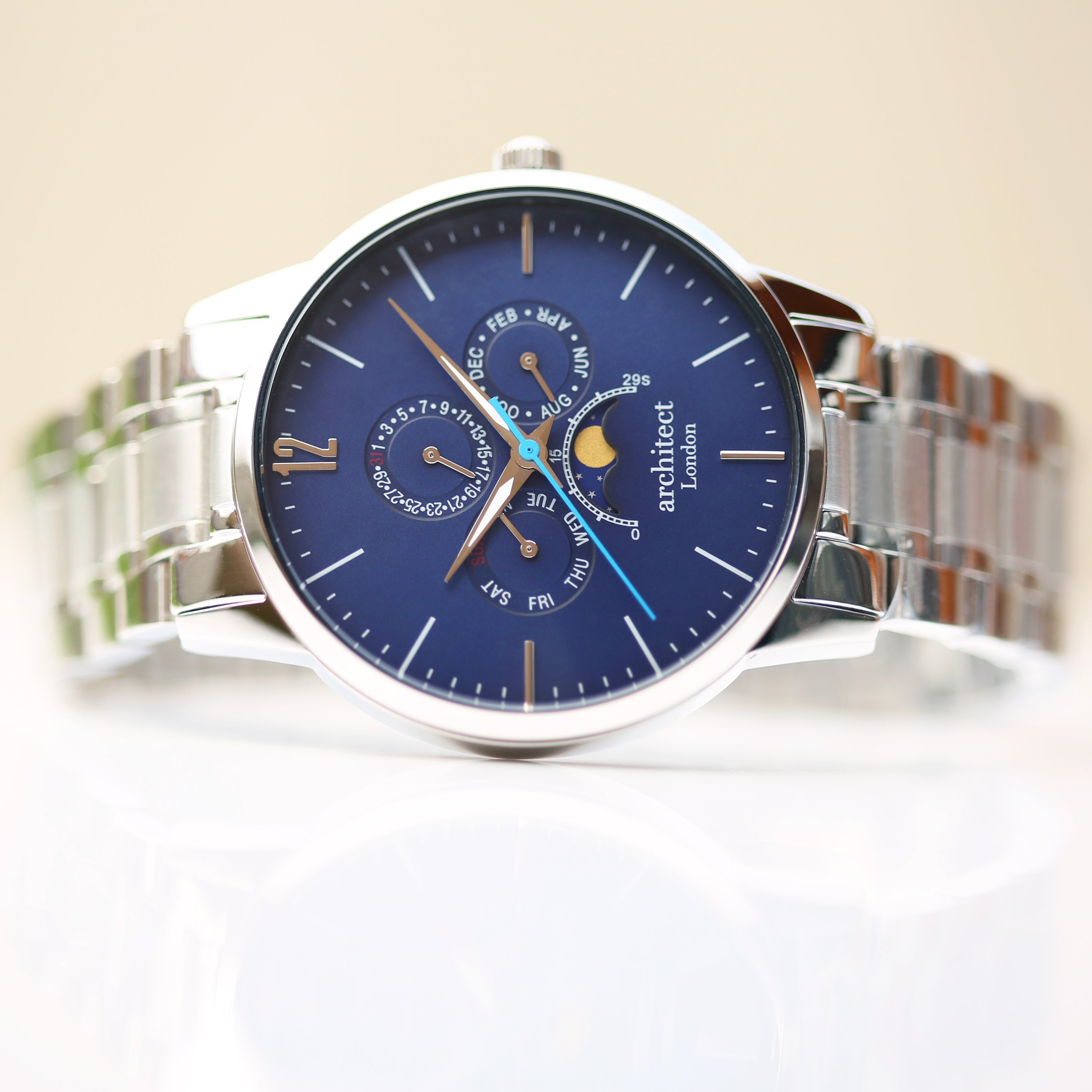Men's Architect Apollo Blue watch featuring modern font engraving, moonphase display, and chronograph subdials in a polished stainless steel case.