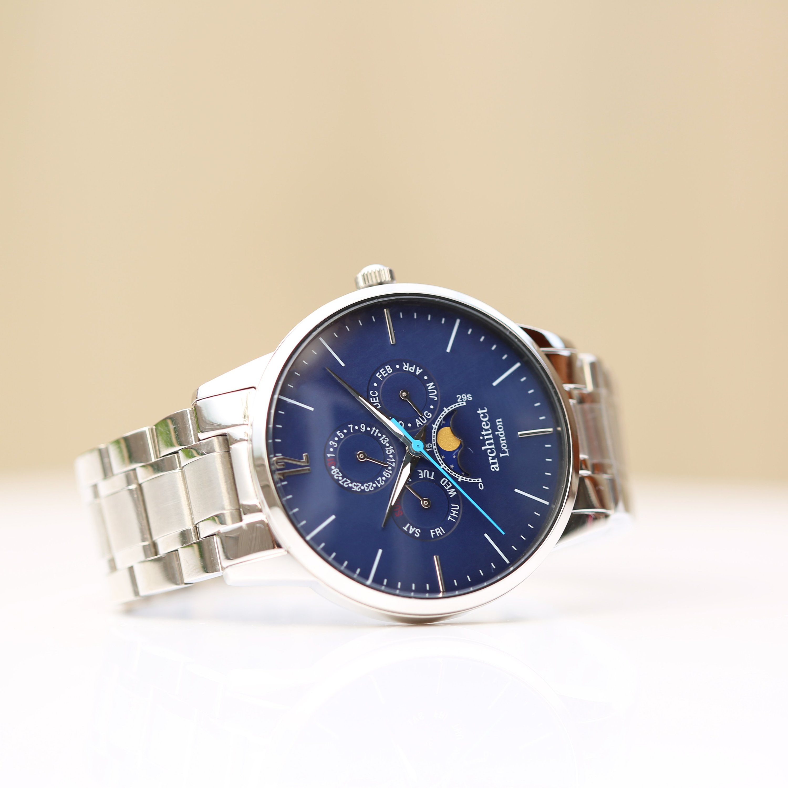 Men's Architect Apollo Blue watch featuring modern font engraving, moonphase display, and chronograph subdials in a polished stainless steel case.