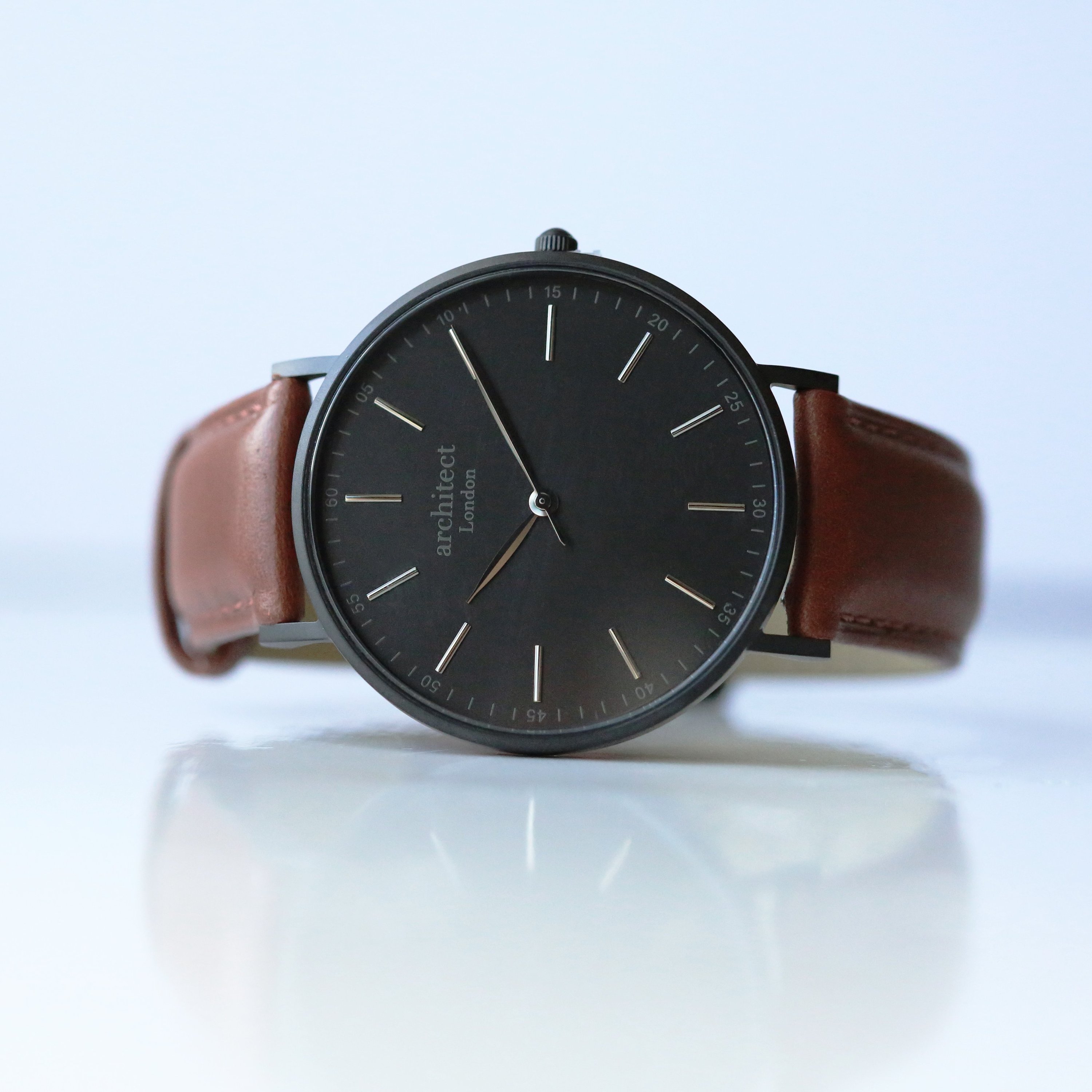 Modern Font Engraving Men's Minimalist Watch with walnut strap, showcasing its elegant design and quality craftsmanship.