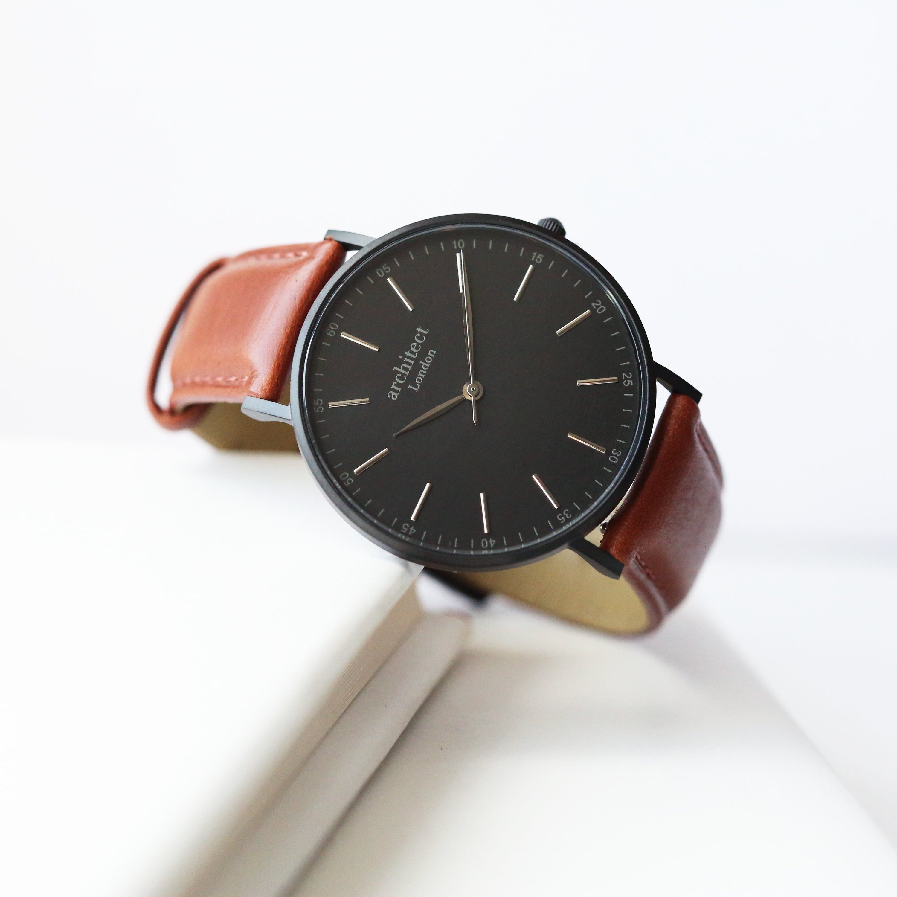 Modern Font Engraving Men's Minimalist Watch with walnut strap, showcasing its elegant design and quality craftsmanship.