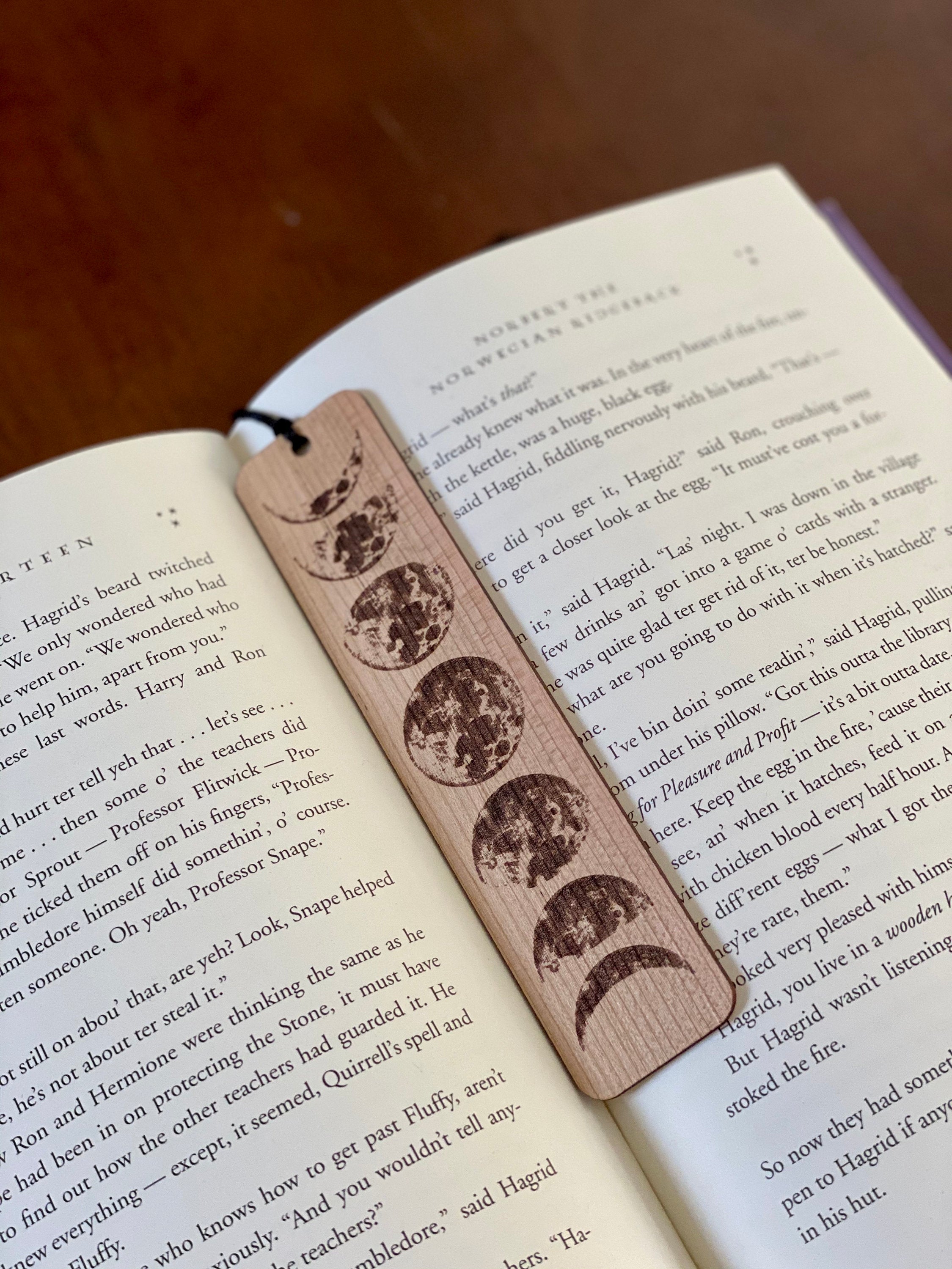 Moon Phases Engraved Wood Bookmark with tassel, showcasing lunar phases design on Cherry hardwood.