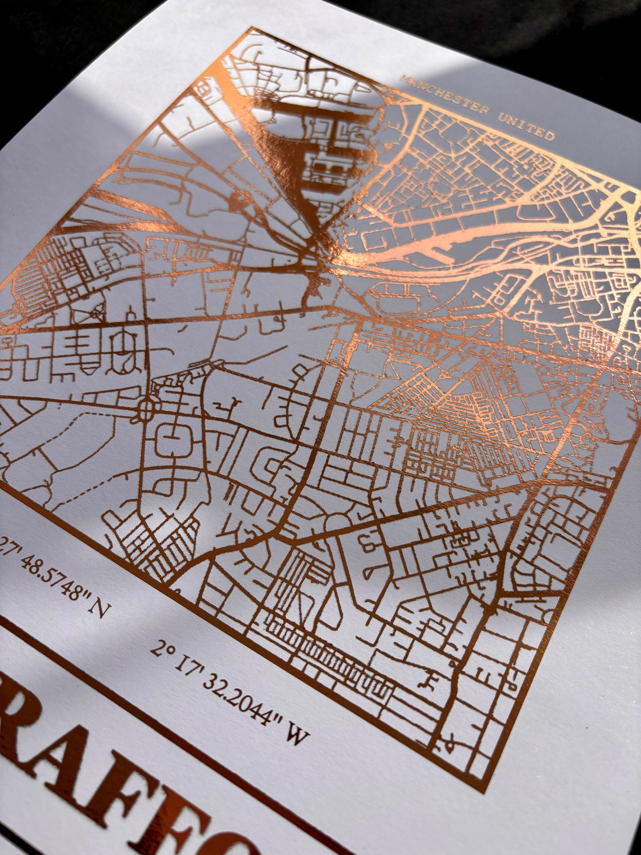 Old Trafford Foil Map Print featuring intricate foil detailing and stadium coordinates, celebrating Manchester United.