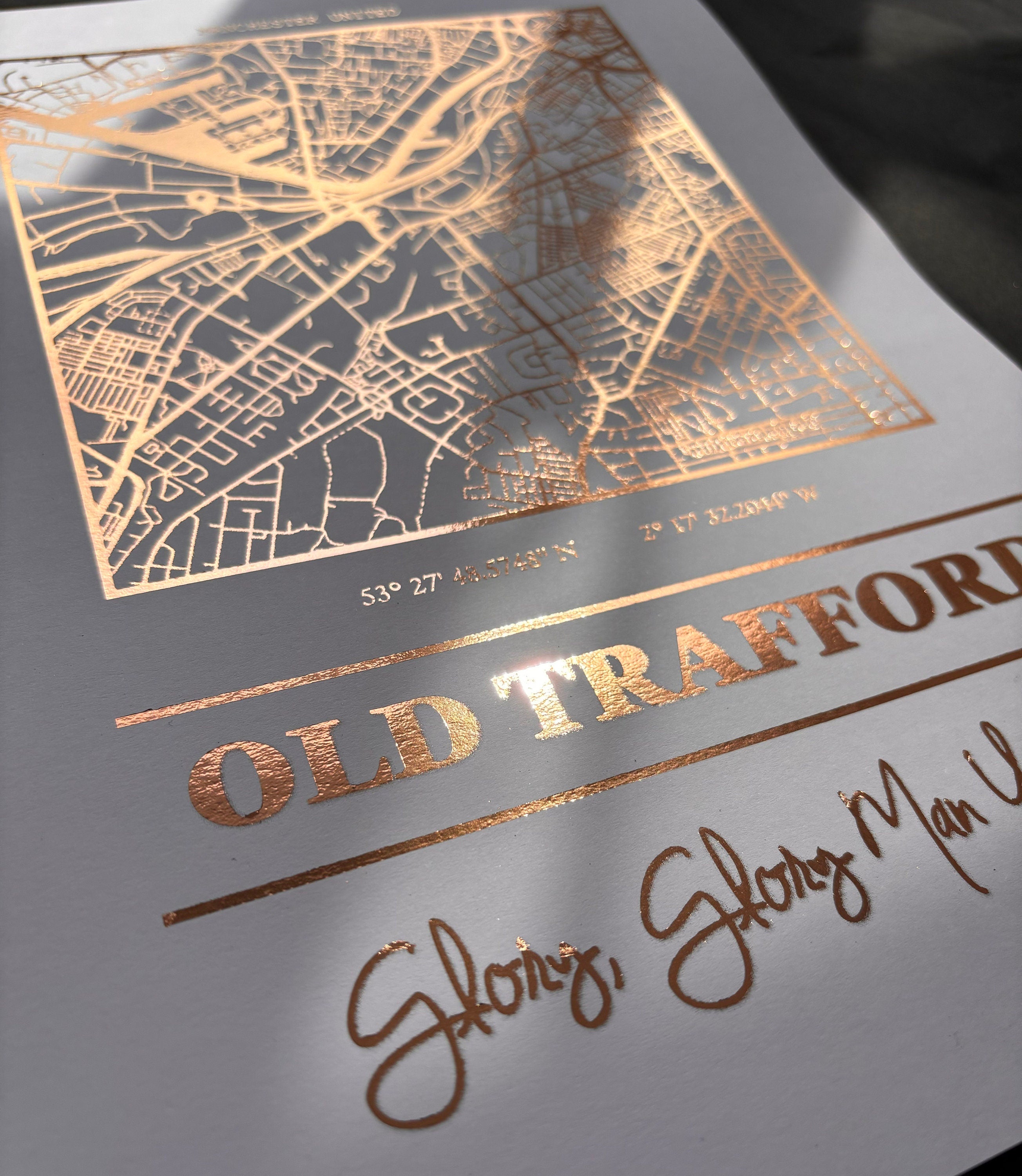 Old Trafford Foil Map Print featuring intricate foil detailing and stadium coordinates, celebrating Manchester United.