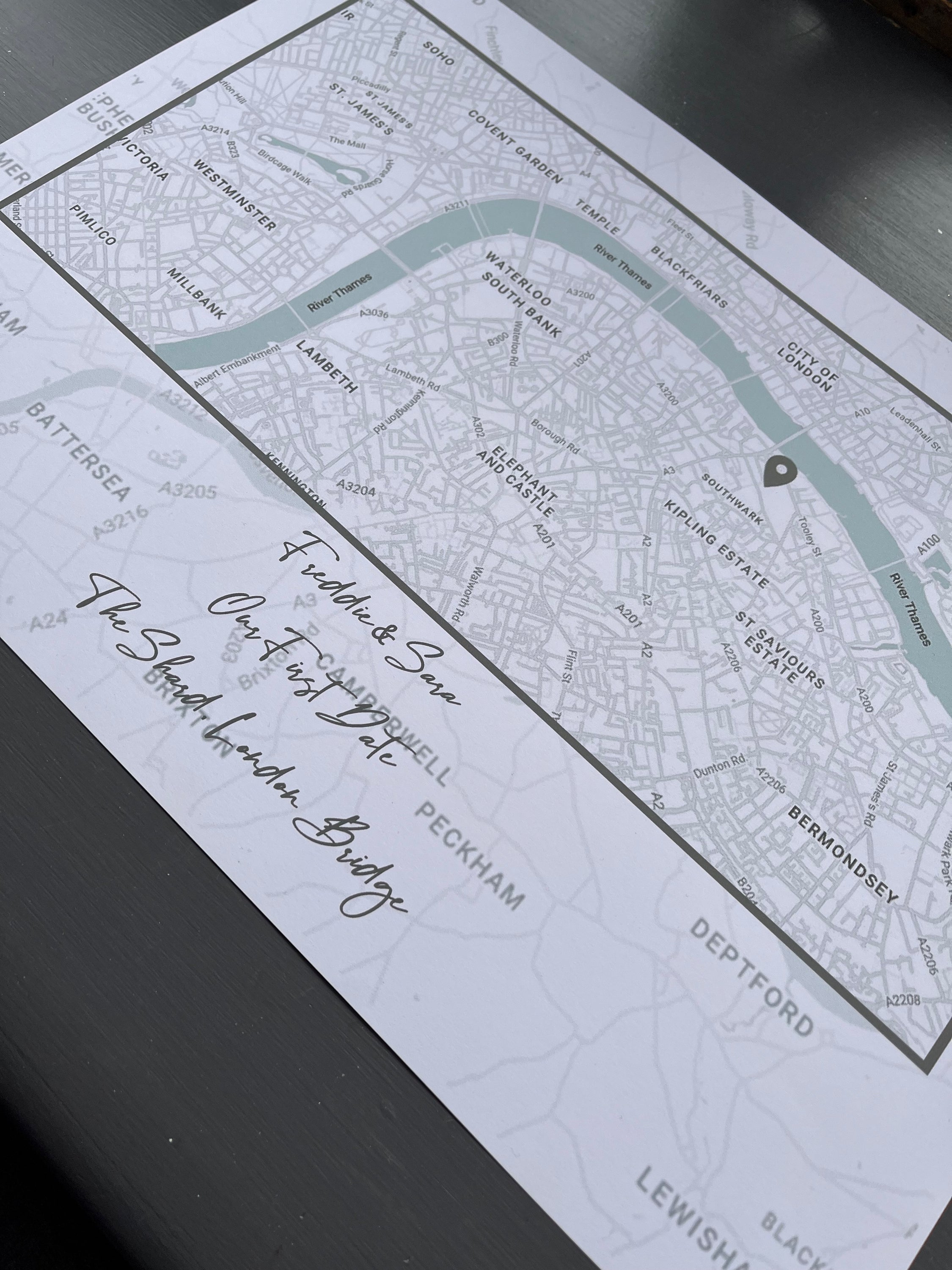 A beautifully crafted First Date Map in elegant greys, showcasing the location of a couple's first date with significant landmarks.