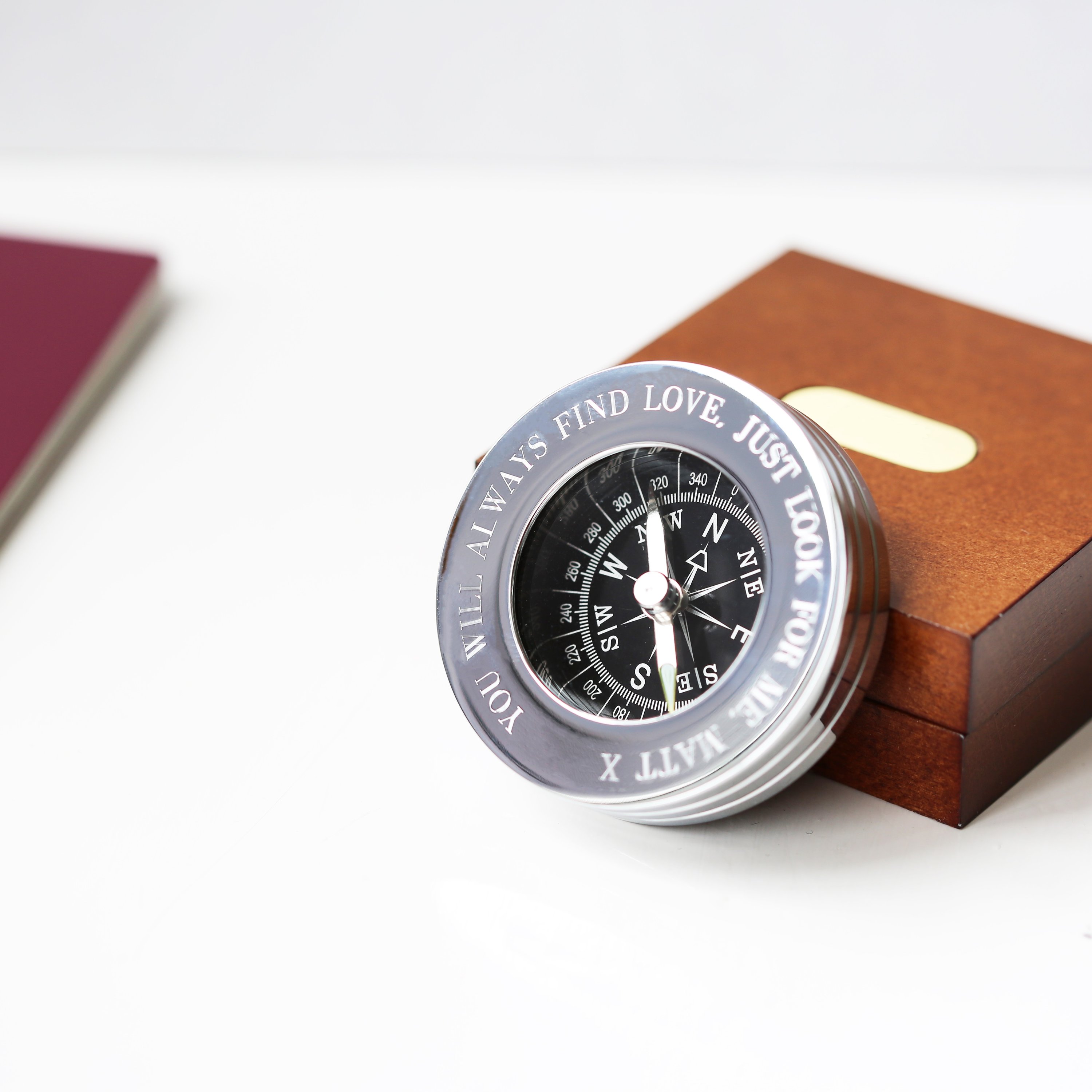 Personalised brass compass in a mahogany timber box, featuring custom handwriting engraving.